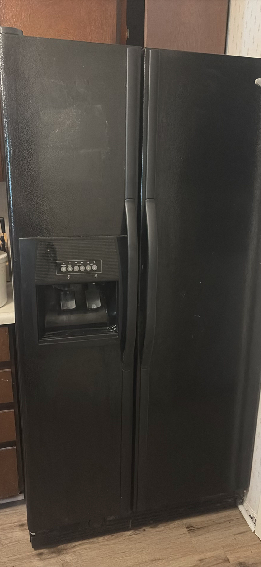 Whirlpool side-by-side refrigerator with ice and water dispenser - image 1 of 9