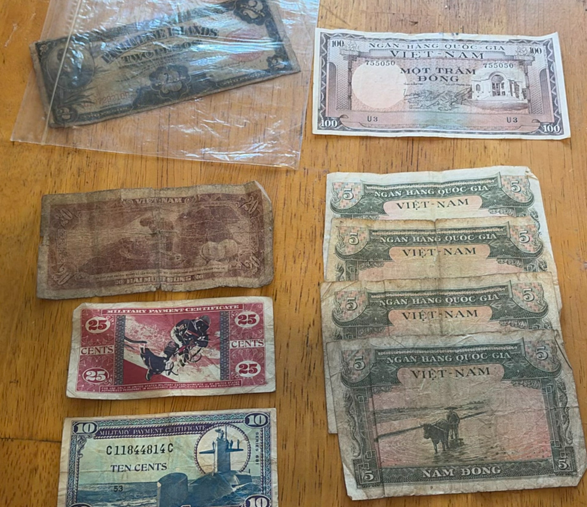 Assorted Vietnamese, Philippine and MPC banknotes - image 1 of 7