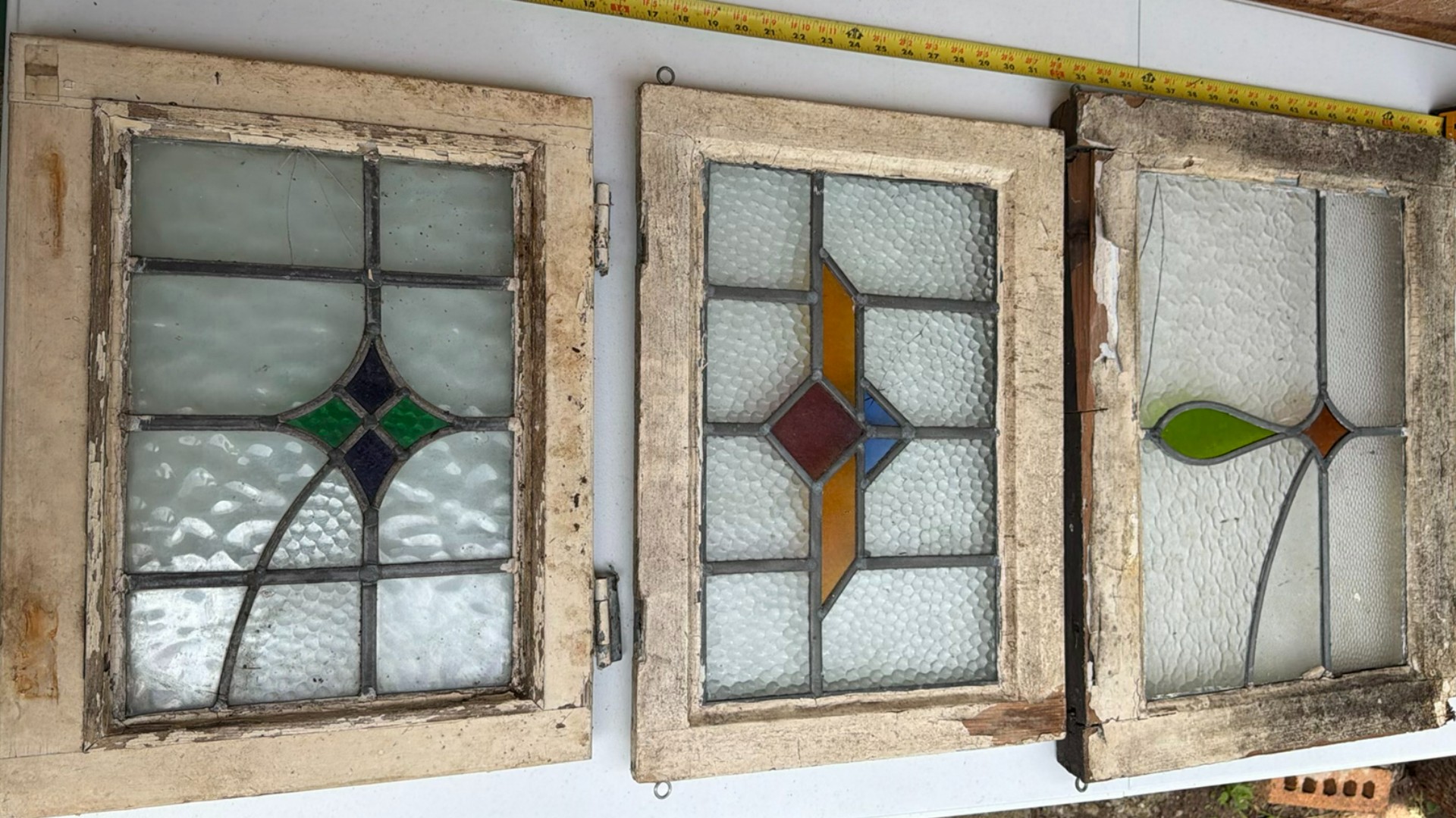 Three stained glass window panels with geometric designs - image 1 of 7