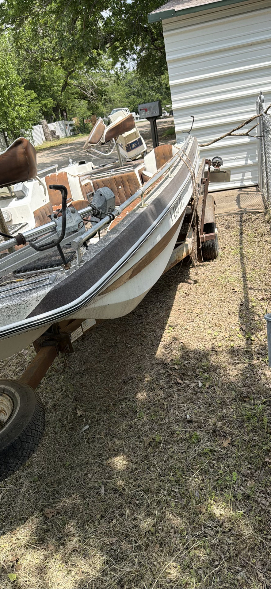 Aluminum fishing boat on trailer with outboard motor - image 3 of 9