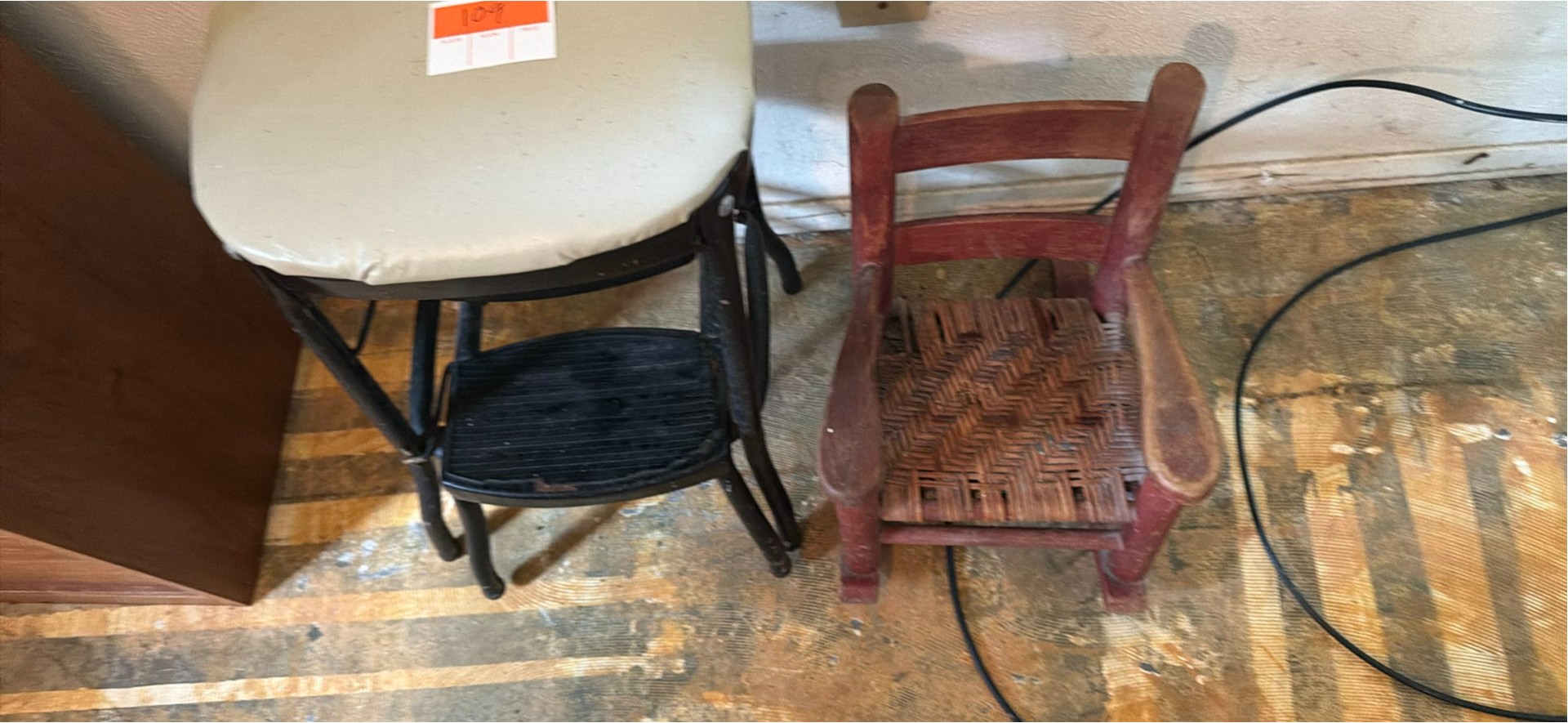 Padded black metal two-tier step stool and wooden chair with a woven seat - image 7 of 8