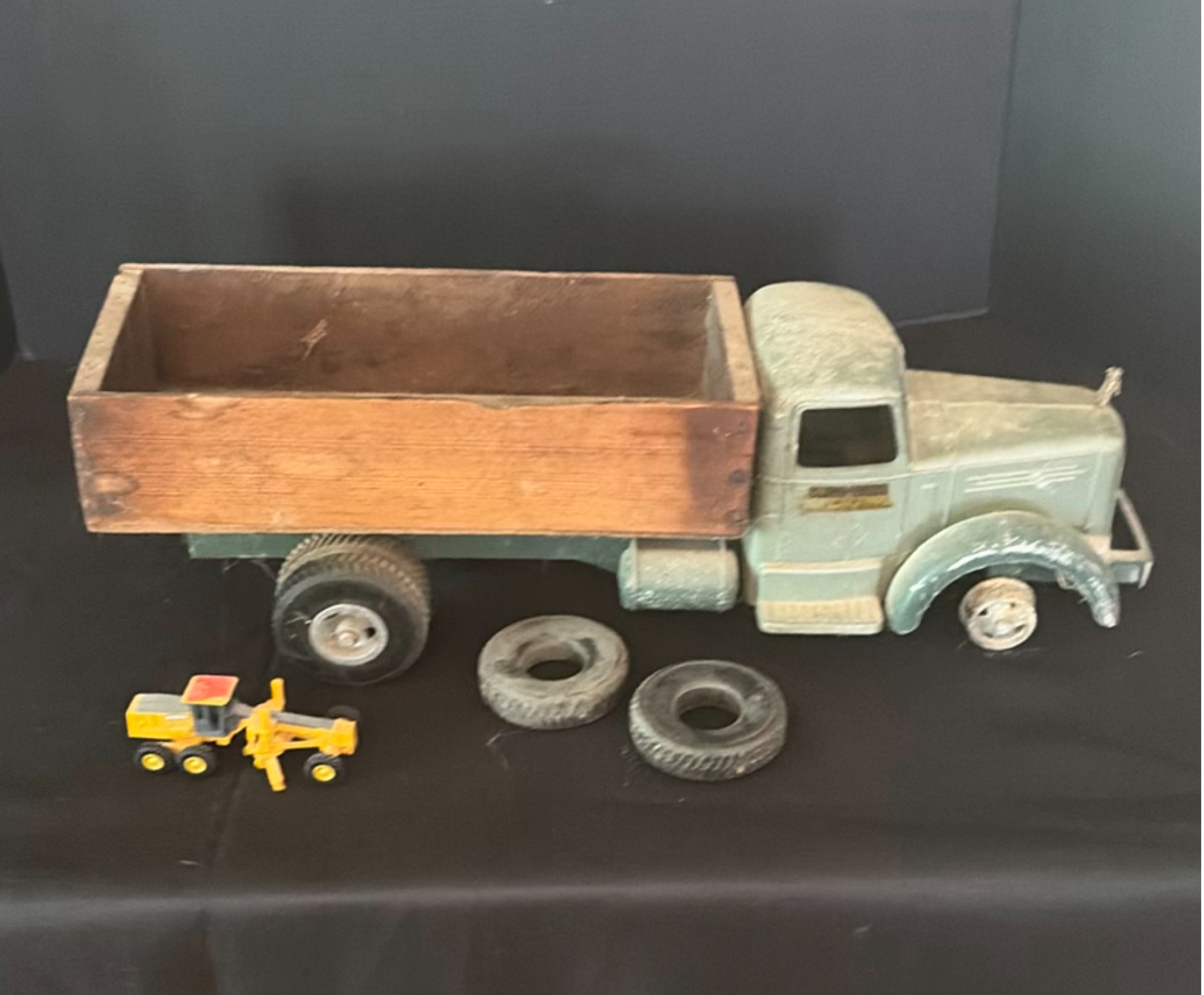 Vintage metal toy trucks with wooden flatbed and accessories - image 1 of 6