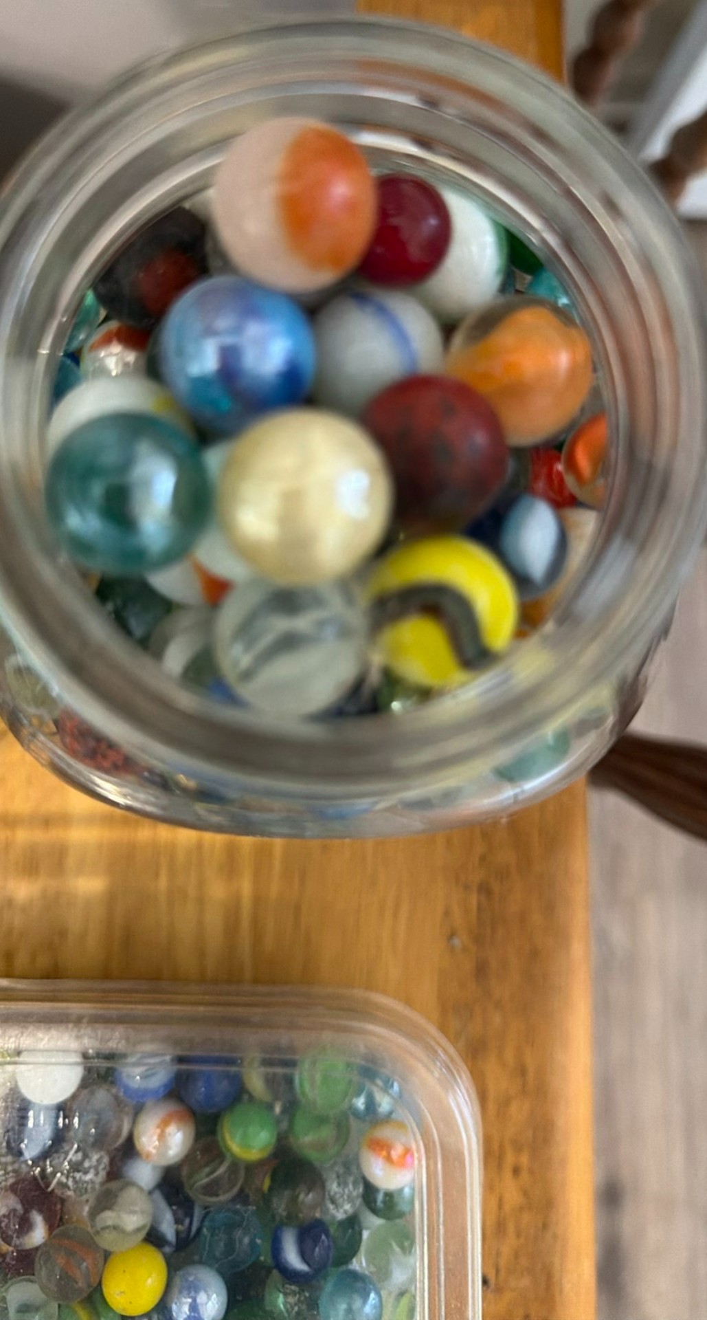 Assorted glass marbles in jars, bowls, and bottles - image 4 of 5