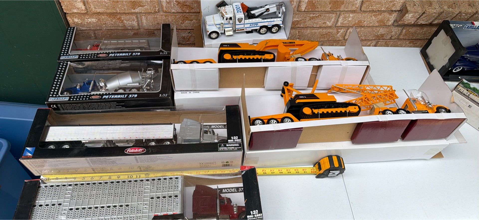 Scale-model toy trucks and construction equipment - image 1 of 7