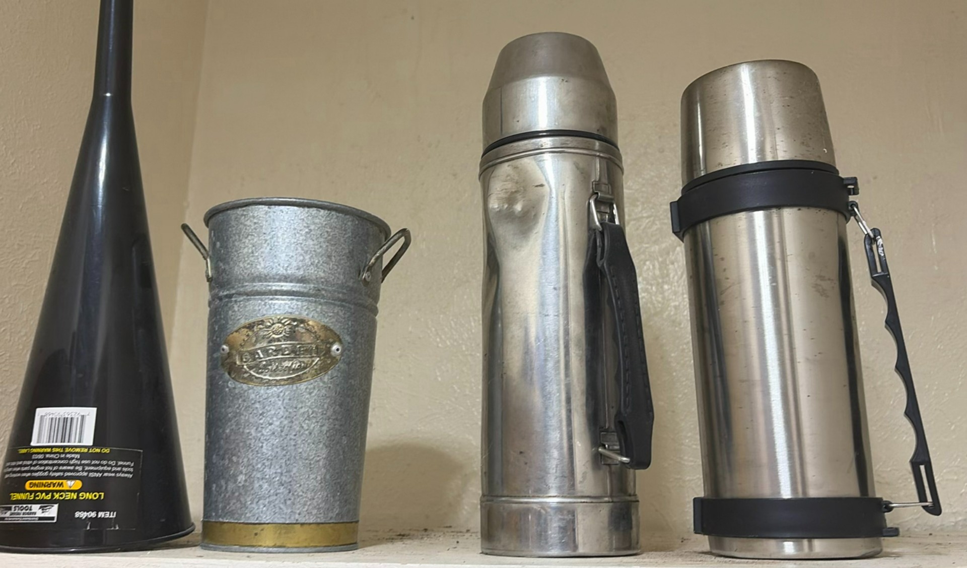 Assorted vintage metal kitchen containers, thermoses, and an oil lamp - image 1 of 9
