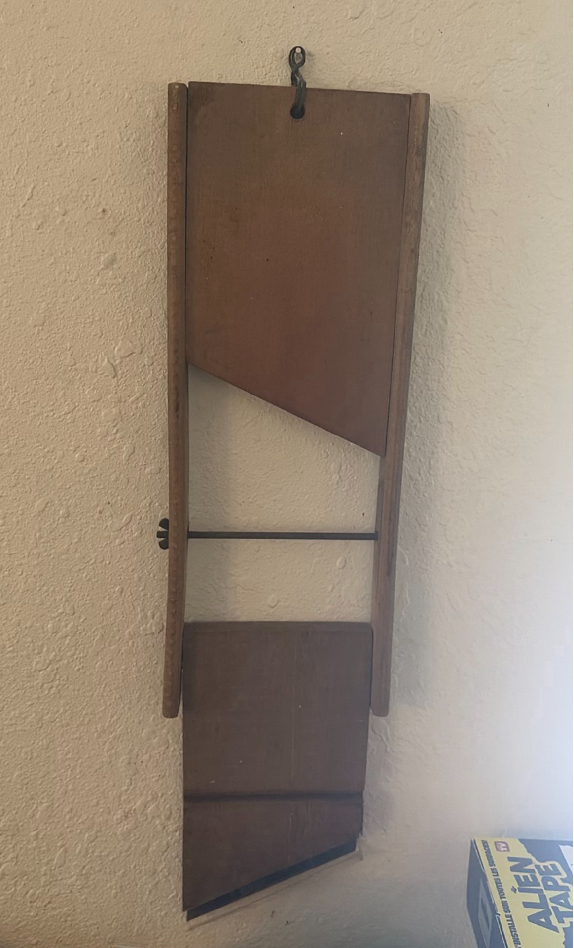 Vintage wall-mounted ship wheel clock, antique telephone, and wooden wall rack - image 7 of 8