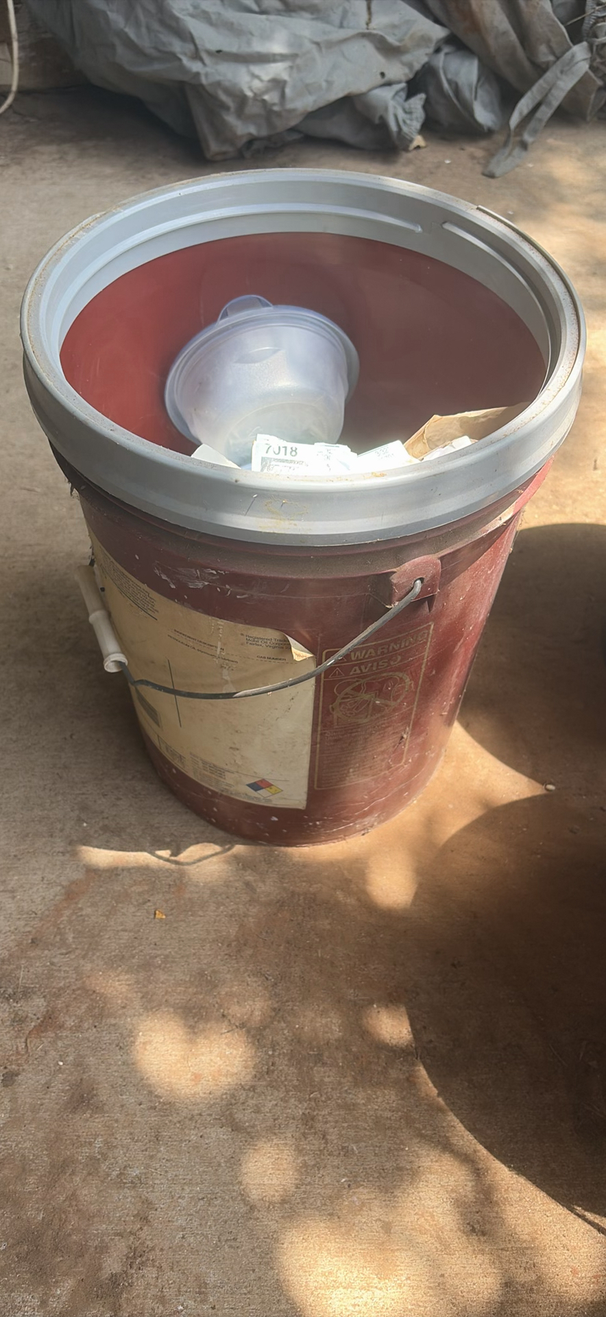 Assorted workshop waste and welding supplies in trash containers - image 8 of 9