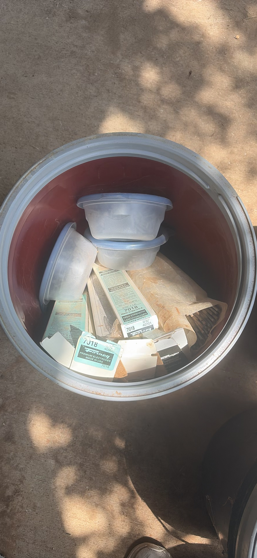 Assorted workshop waste and welding supplies in trash containers - image 7 of 9