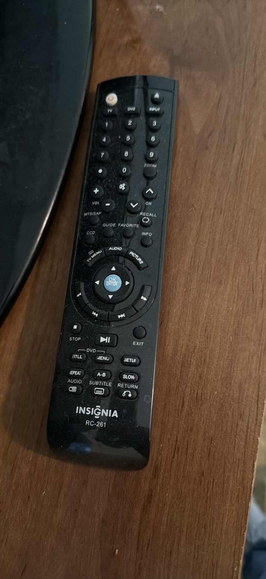 Insignia flat-screen TV with built-in DVD player on wooden dresser - image 4 of 5