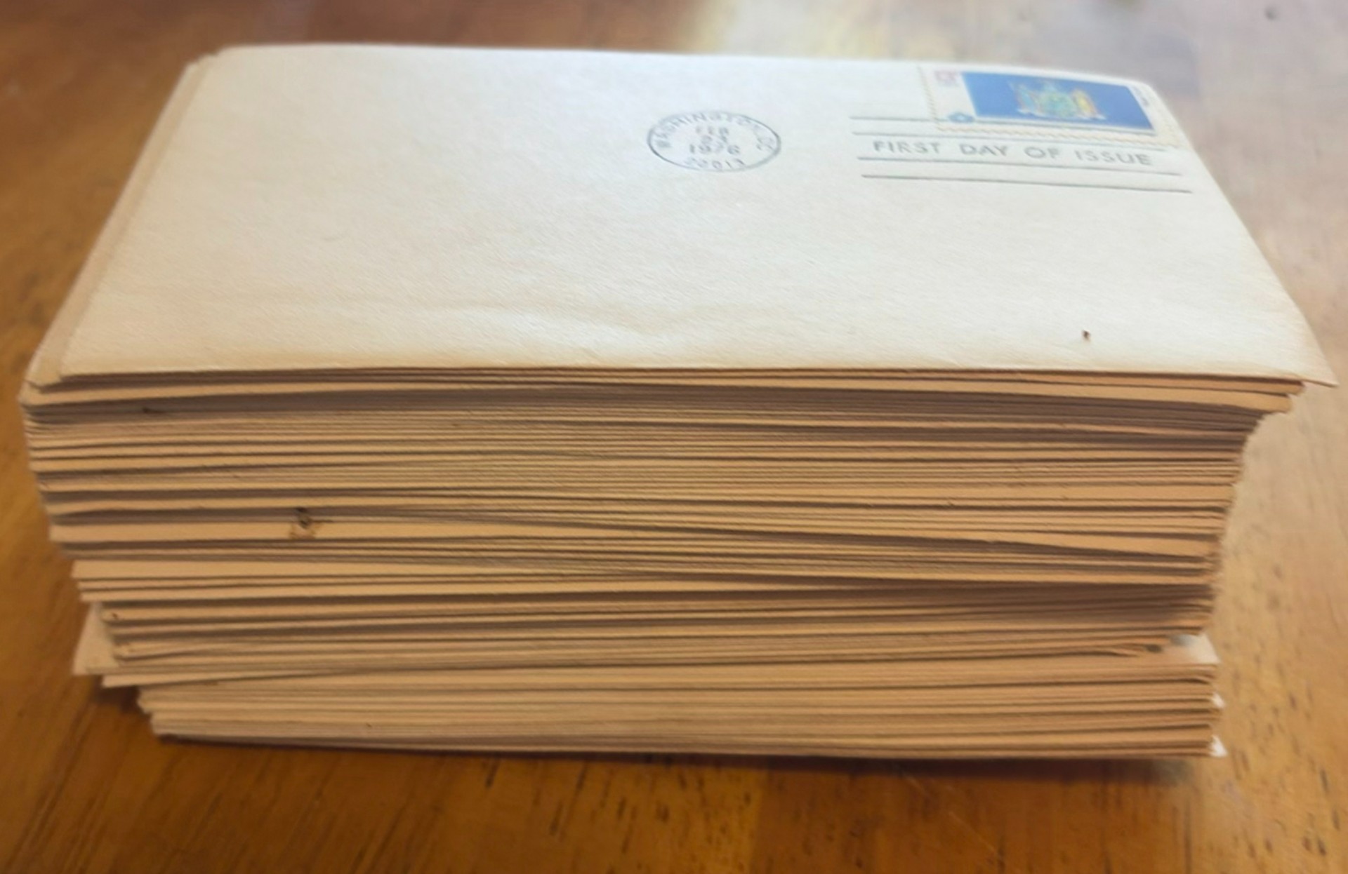 First Day of Issue stamp covers and a stack of envelopes - image 1 of 4
