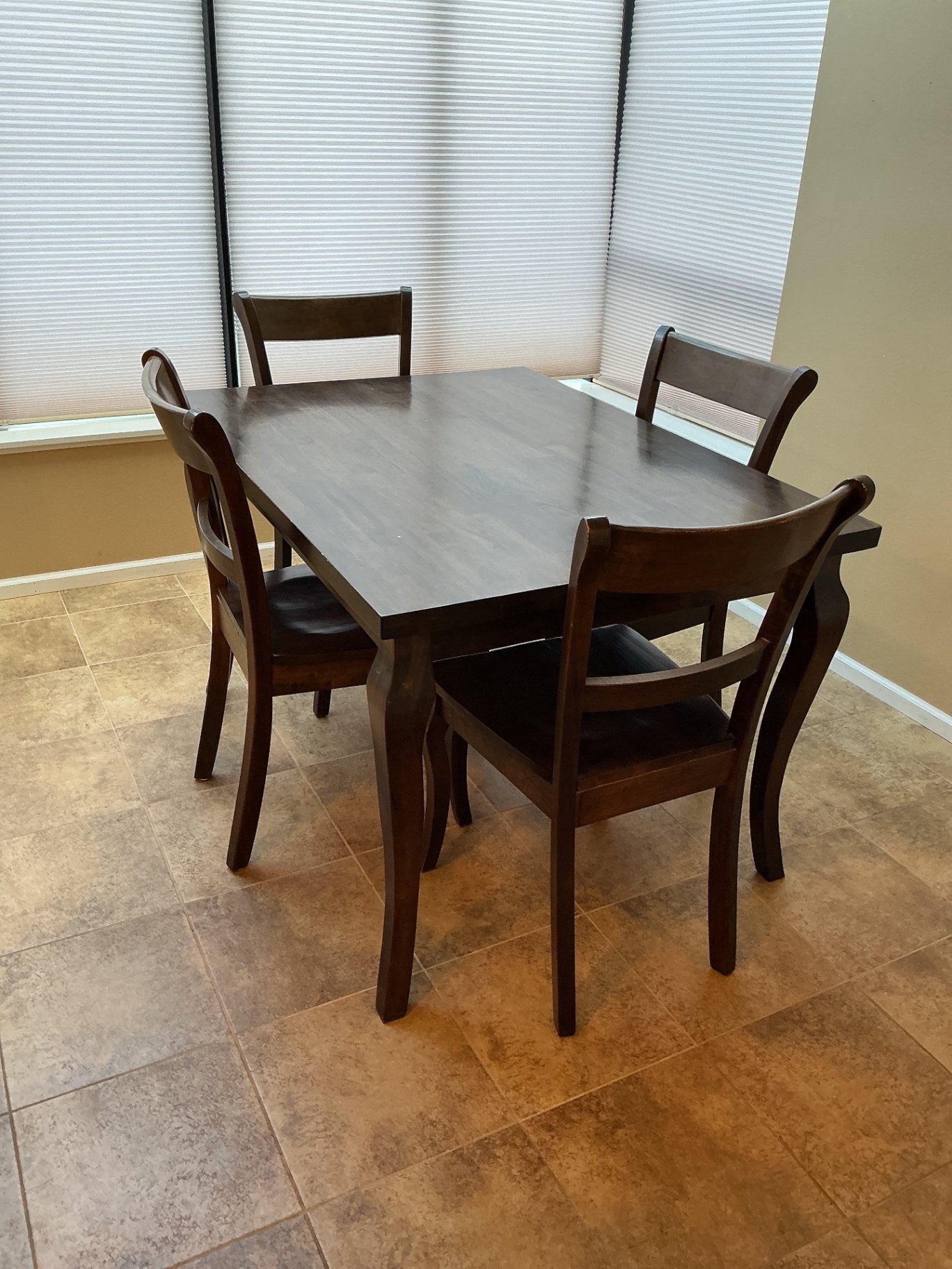 Dark wood dining table with four matching chairs - image 1 of 5
