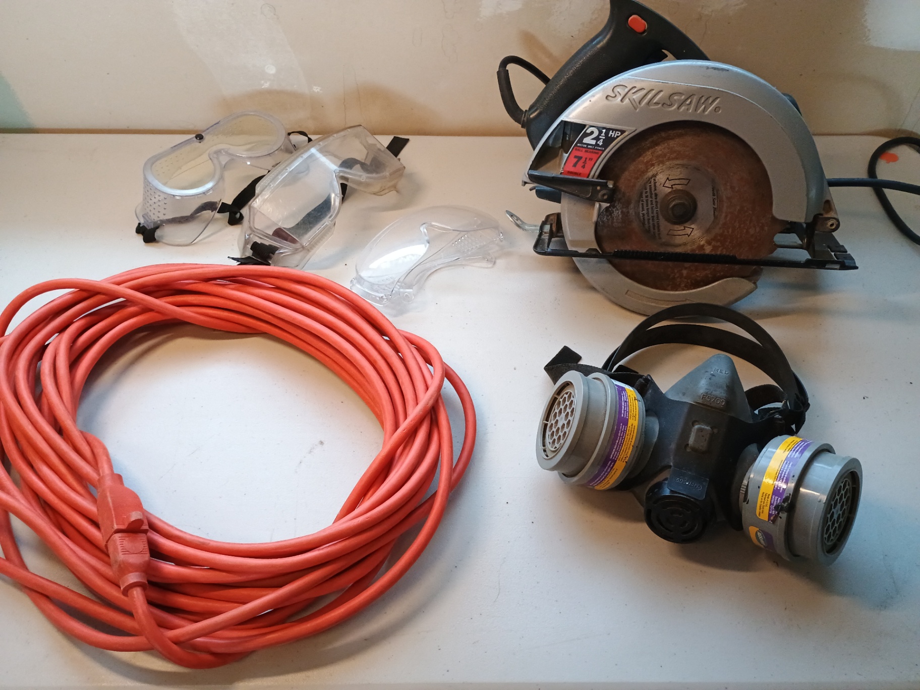 Extension cord, safety goggles, respirator, and circular saw - image 1 of 5