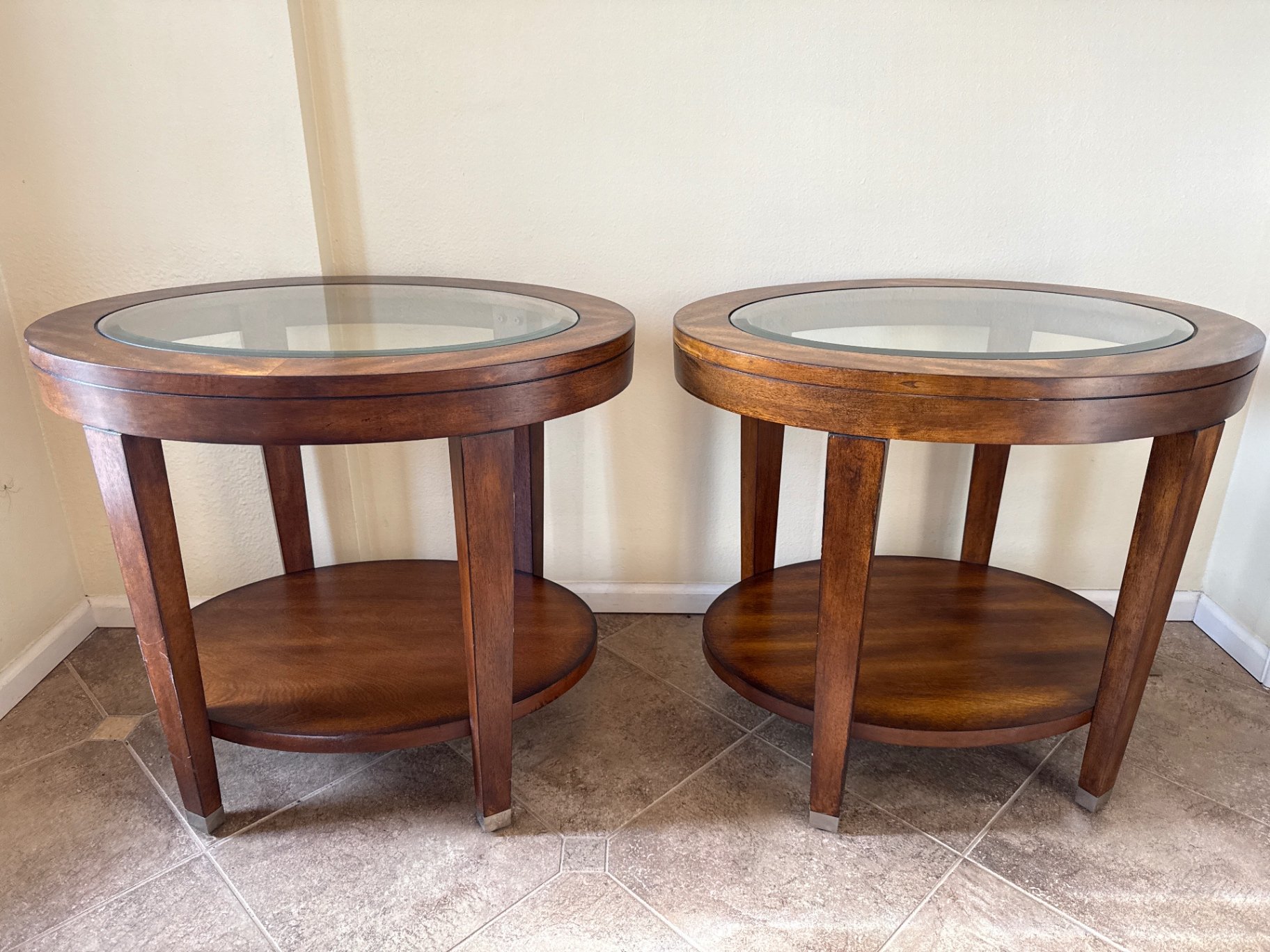 Pair of round wood end tables with glass tops - image 1 of 3