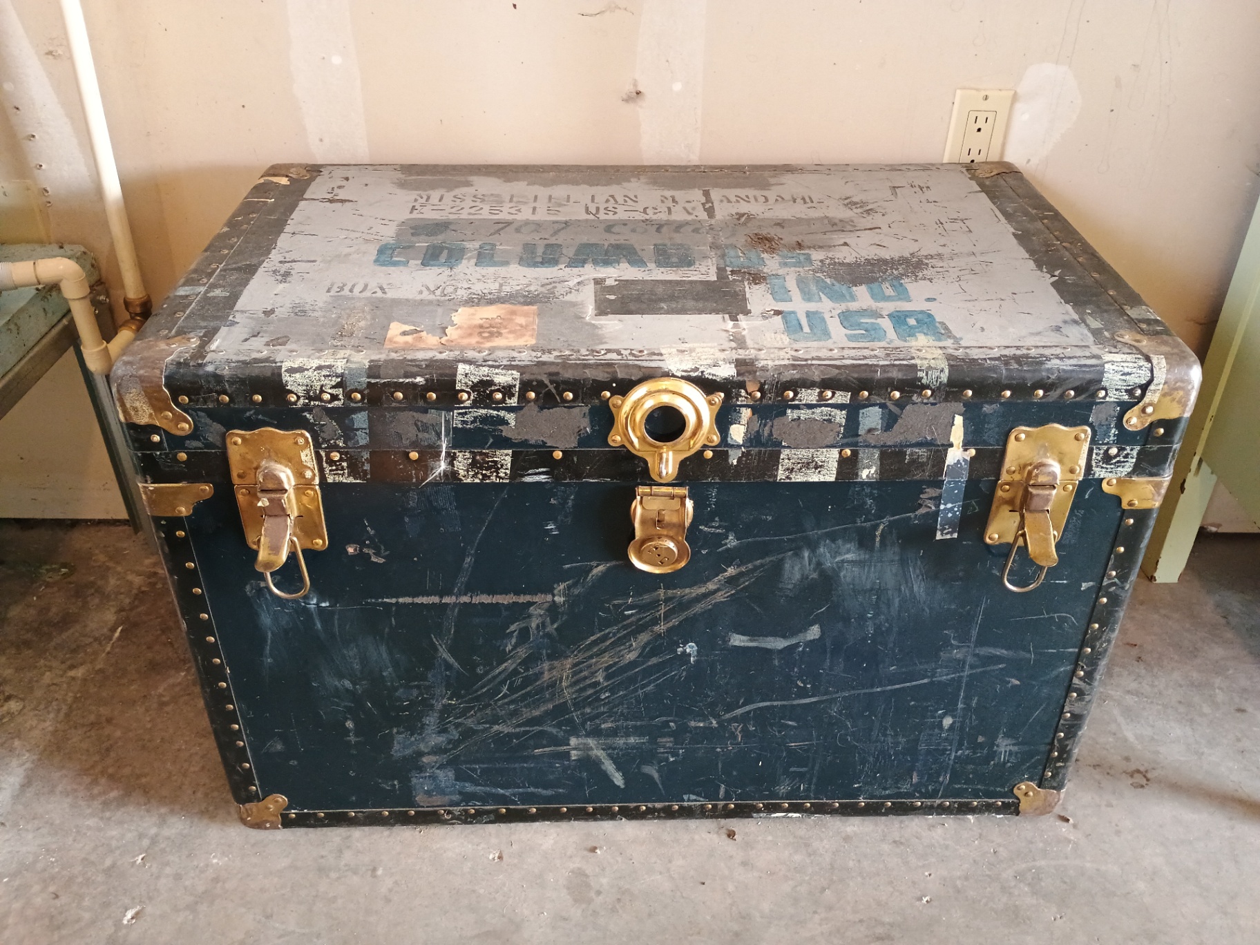 Vintage riveted metal trunk with blue stenciled markings - image 1 of 7