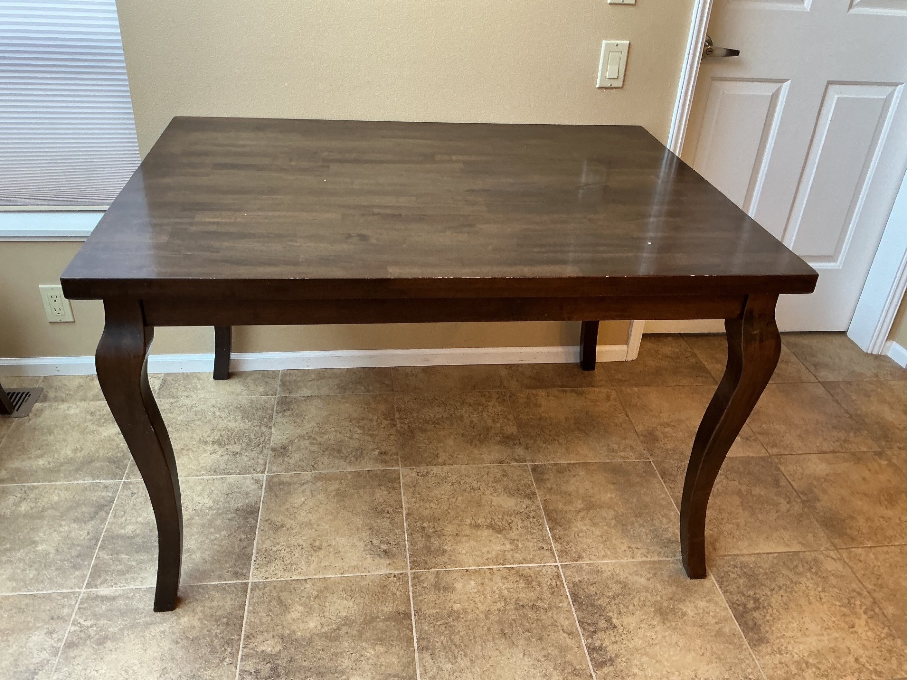 Dark wood dining table with four matching chairs - image 2 of 5