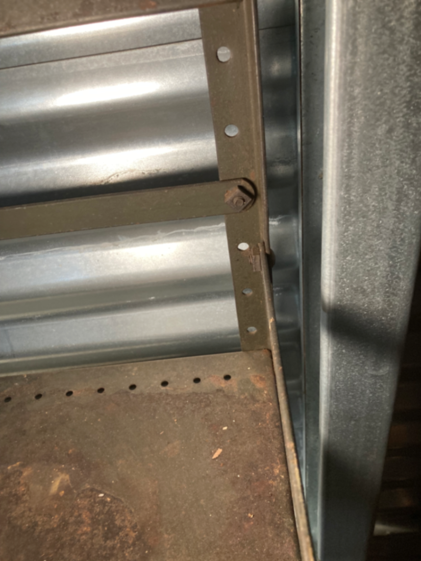 Industrial metal shelving unit with Mohawk Beverages sign - image 4 of 5