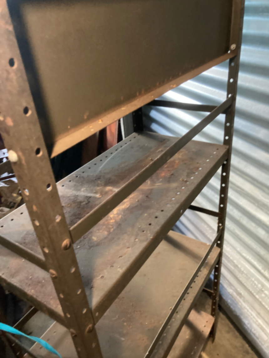 Industrial metal shelving unit with Mohawk Beverages sign - image 5 of 5
