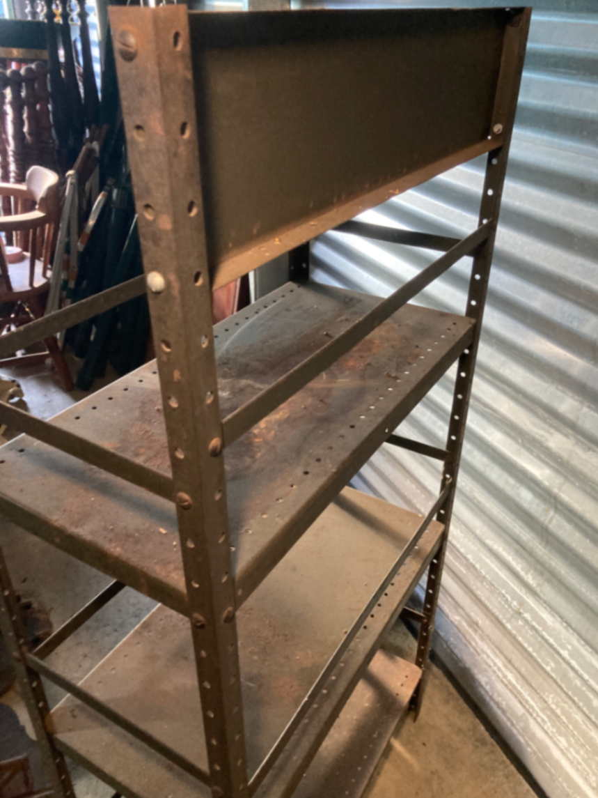 Industrial metal shelving unit with Mohawk Beverages sign - image 2 of 5