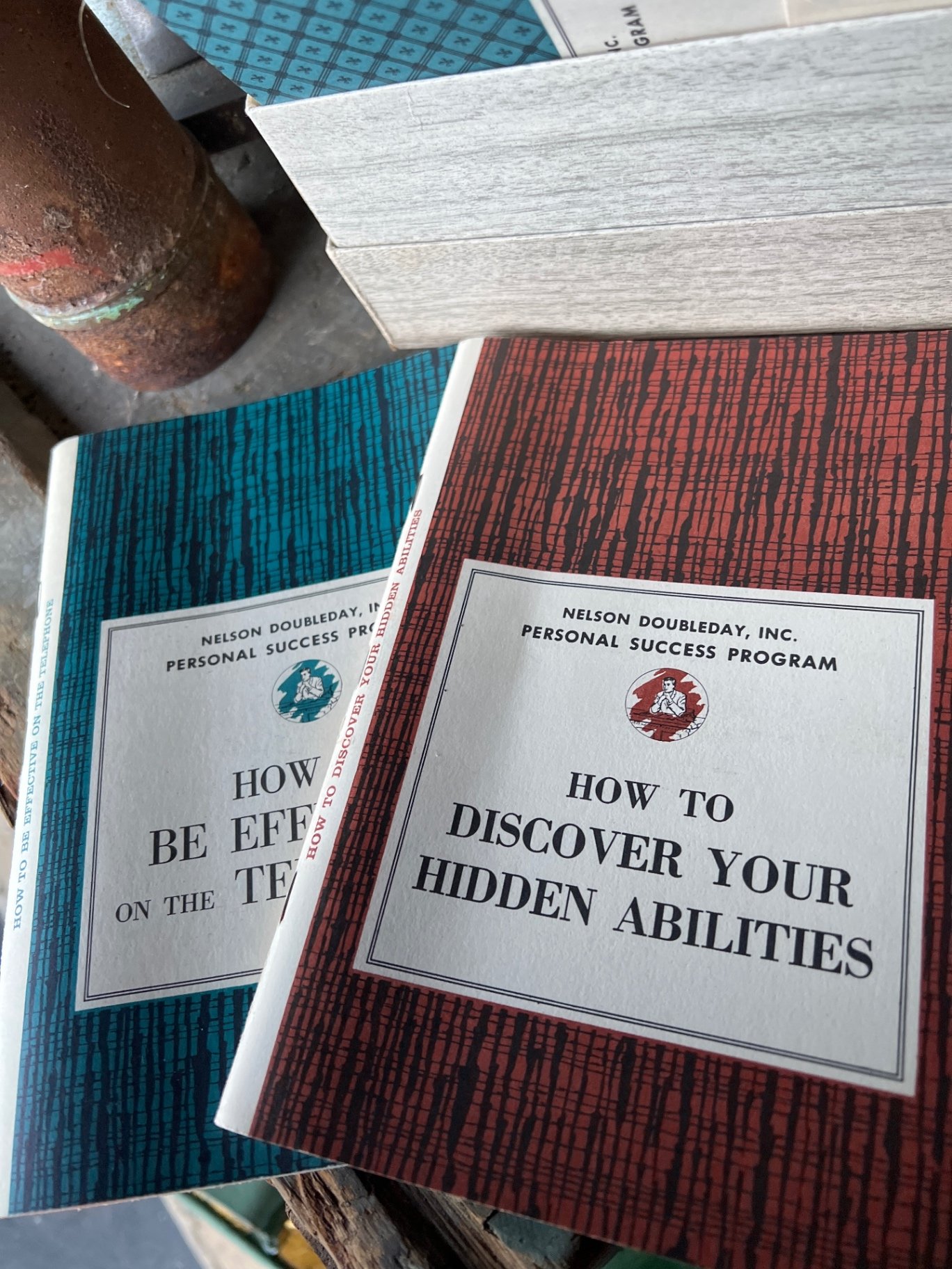 Vintage vacuum cleaner, rusted cylinder, and vintage books - image 3 of 6