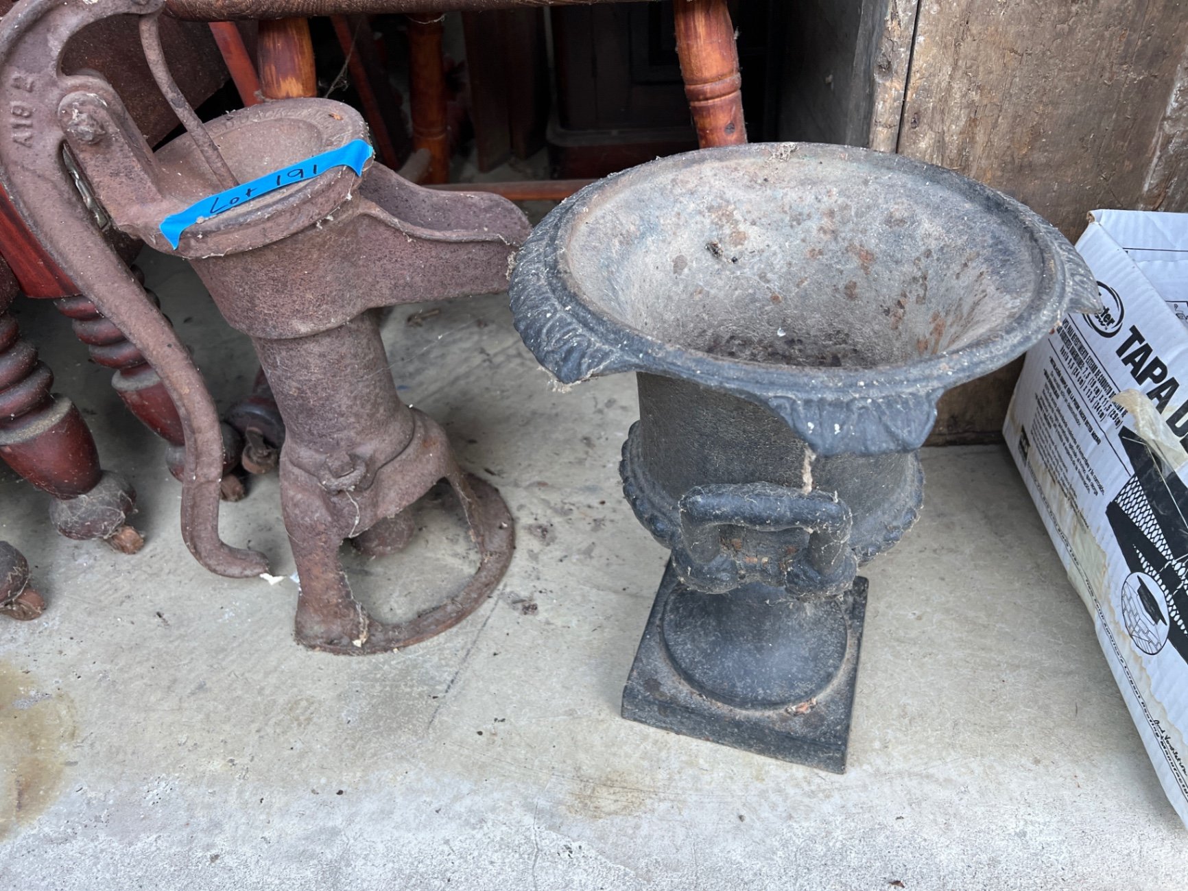 Rusty antique metal water pump and urn  - image 1 of 6