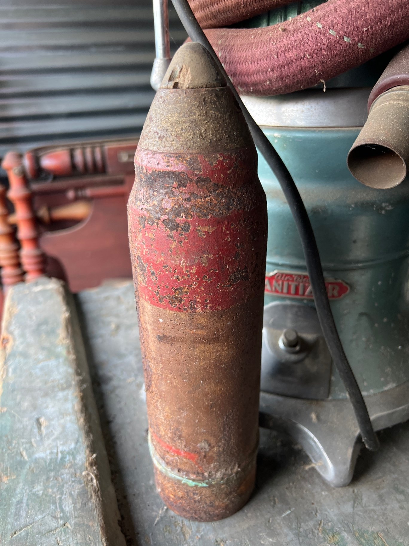Vintage vacuum cleaner, rusted cylinder, and vintage books - image 4 of 6