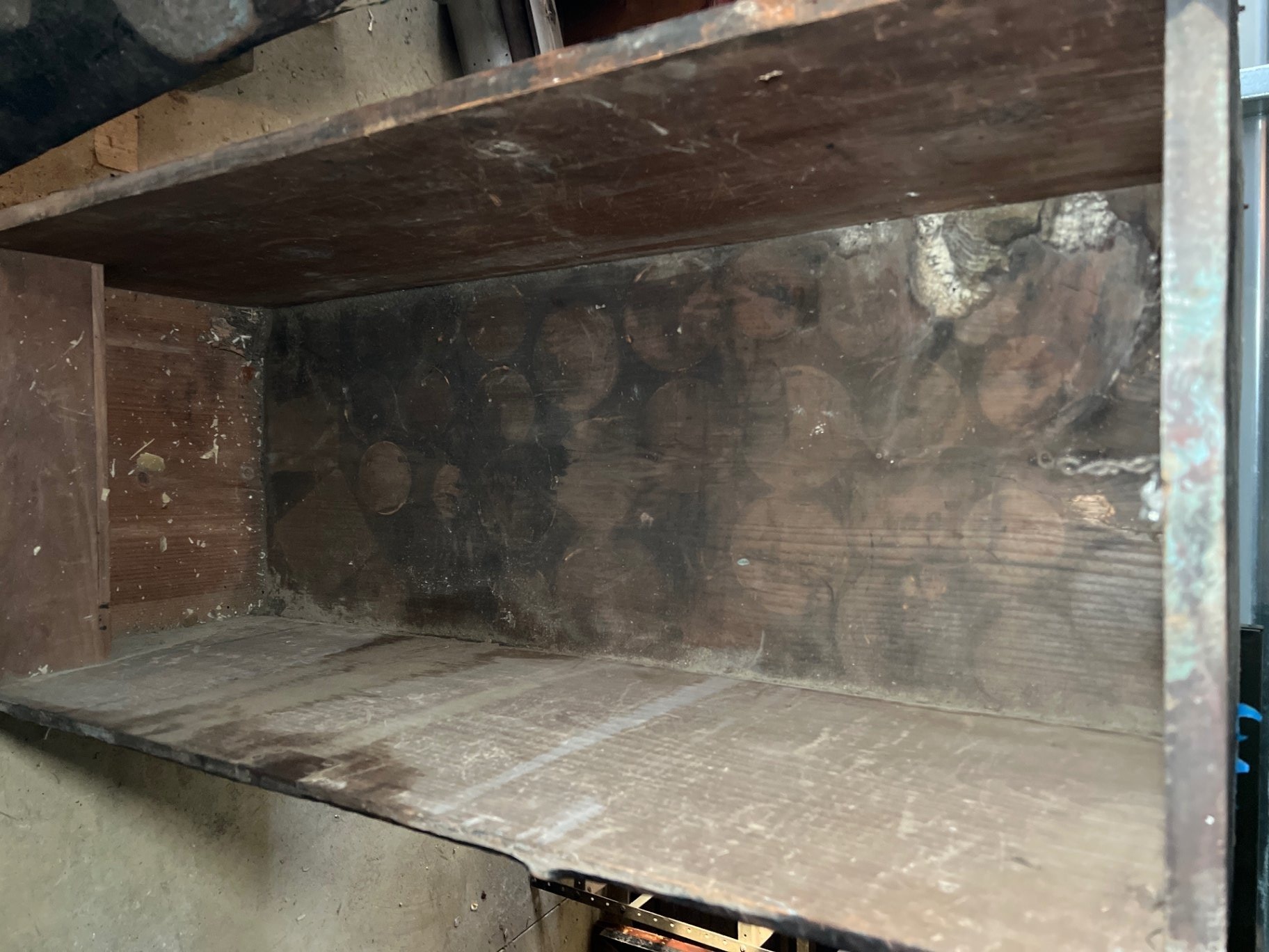 Wooden trunk with rusted metal legs and detached top - image 1 of 8