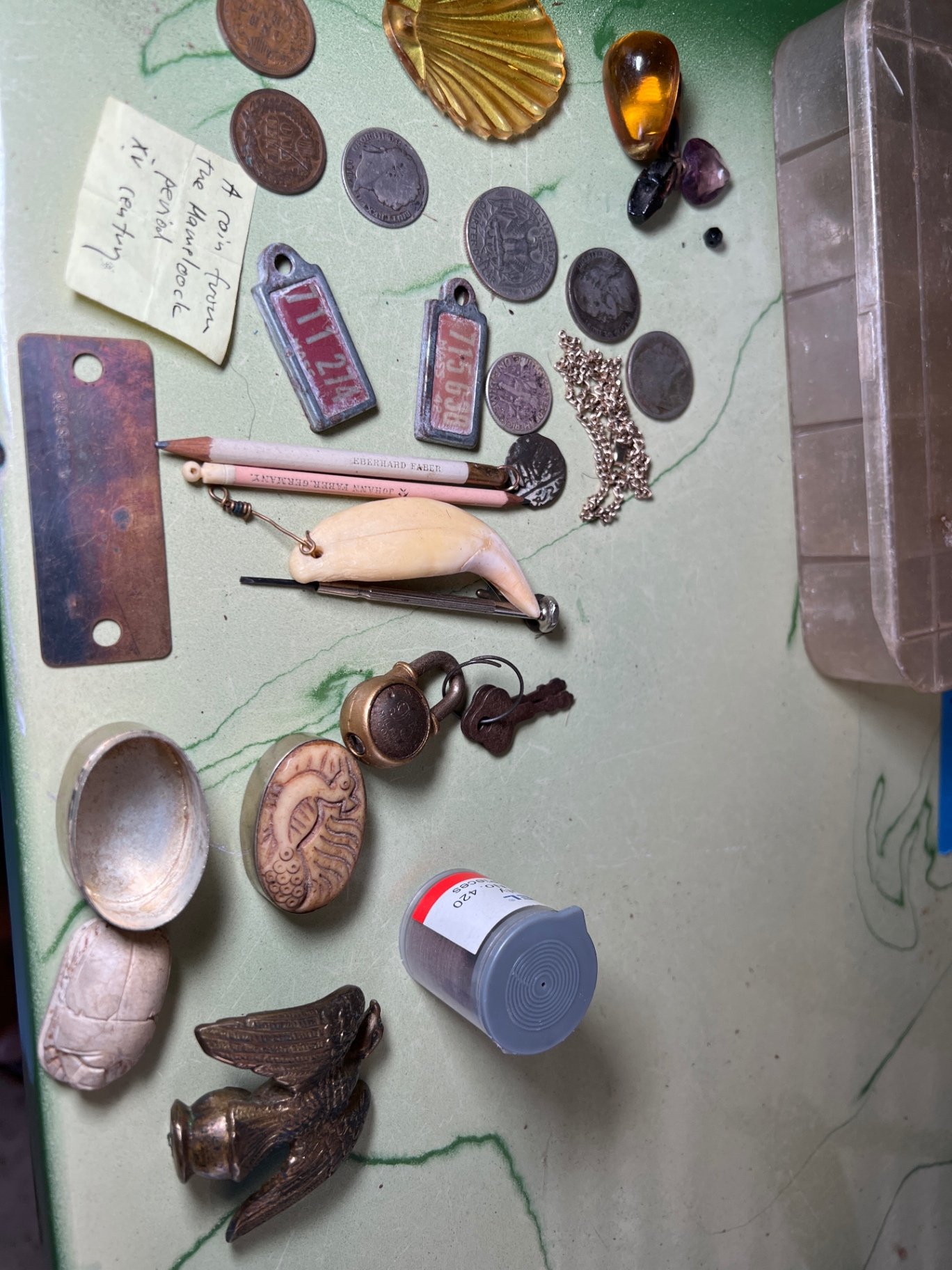 Assorted coins, pendants and small trinkets - image 1 of 10