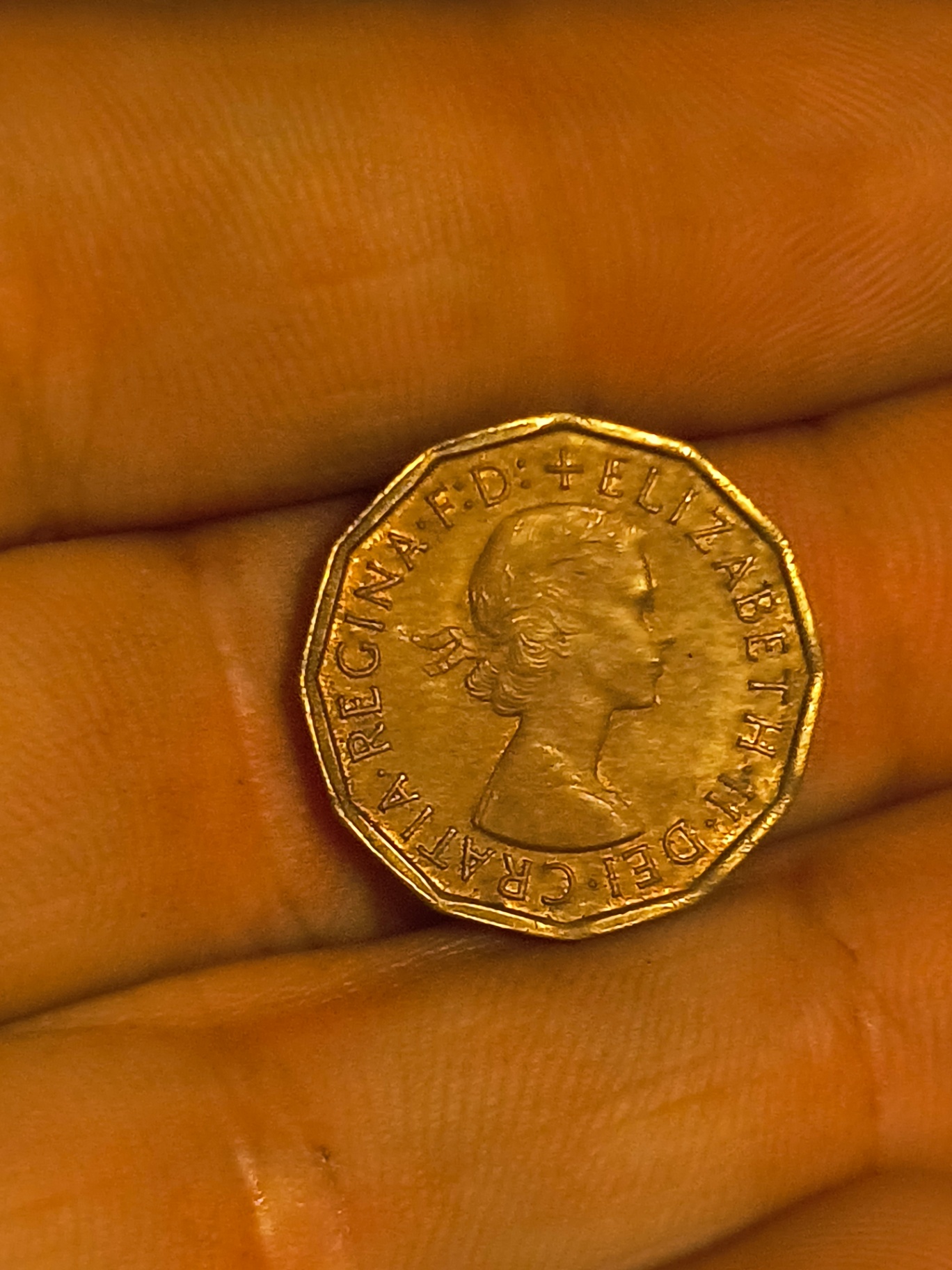 a 1966 twelve-sided piece and a Queen Elizabeth II portrait coin - image 2 of 2