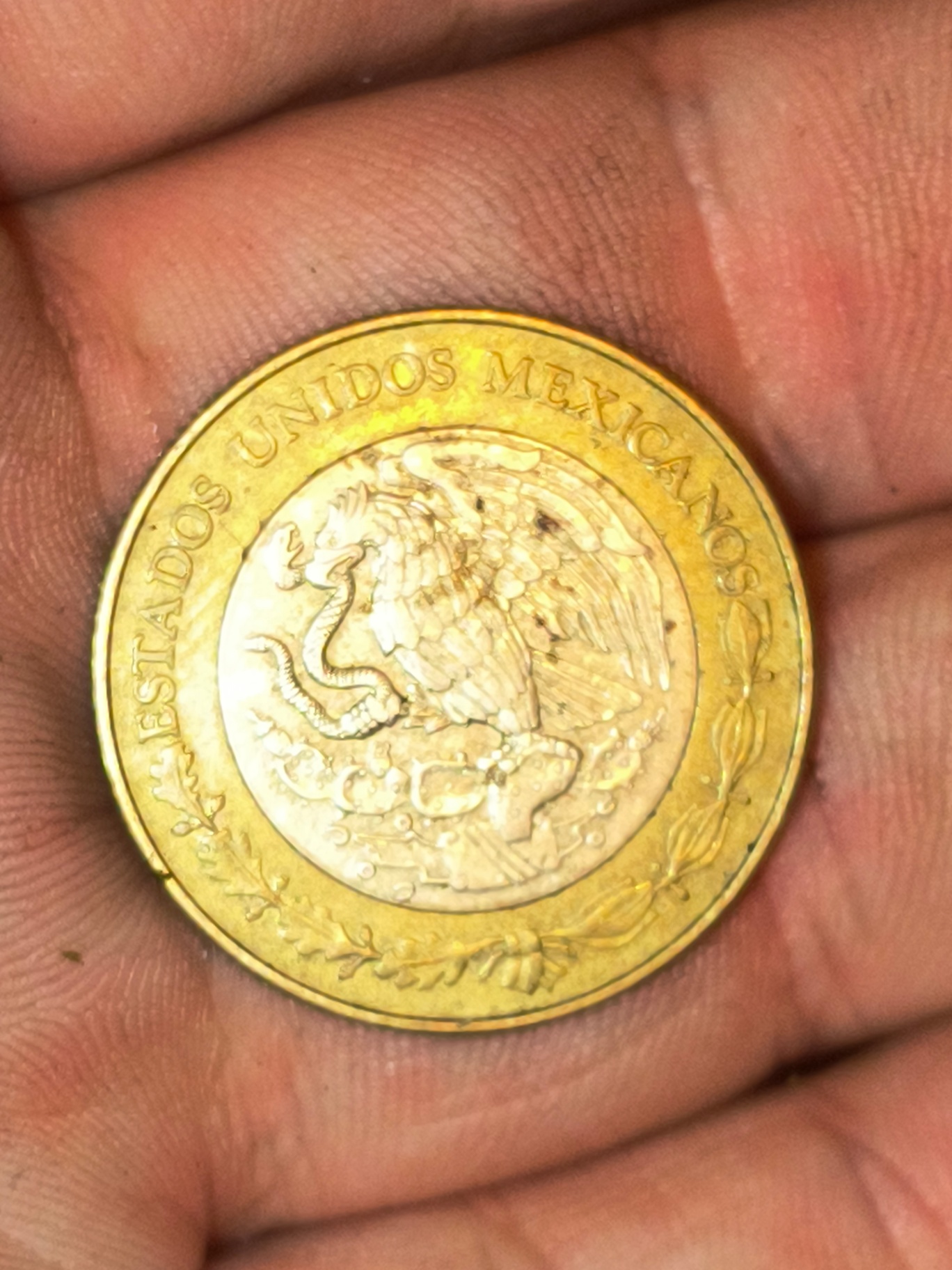 Mexican coins – bi-metallic ringed coin and Aztec calendar coin - image 1 of 2