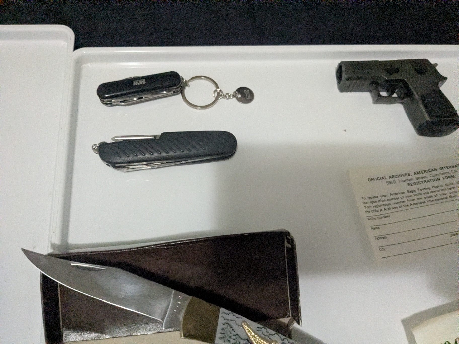 Mixed Outdoor & Collectible Lot – Knife, Flashlight, Tactical Bag, Replica Pistol Torch Lighter, Multi-Tools & Vintage Paperwork - image 7 of 12