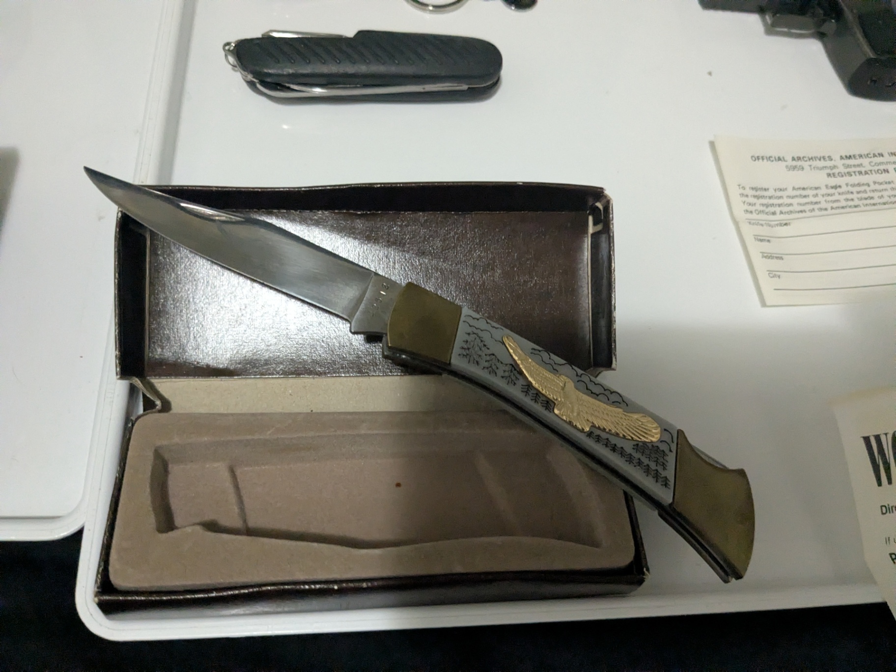 Mixed Outdoor & Collectible Lot – Knife, Flashlight, Tactical Bag, Replica Pistol Torch Lighter, Multi-Tools & Vintage Paperwork - image 9 of 12