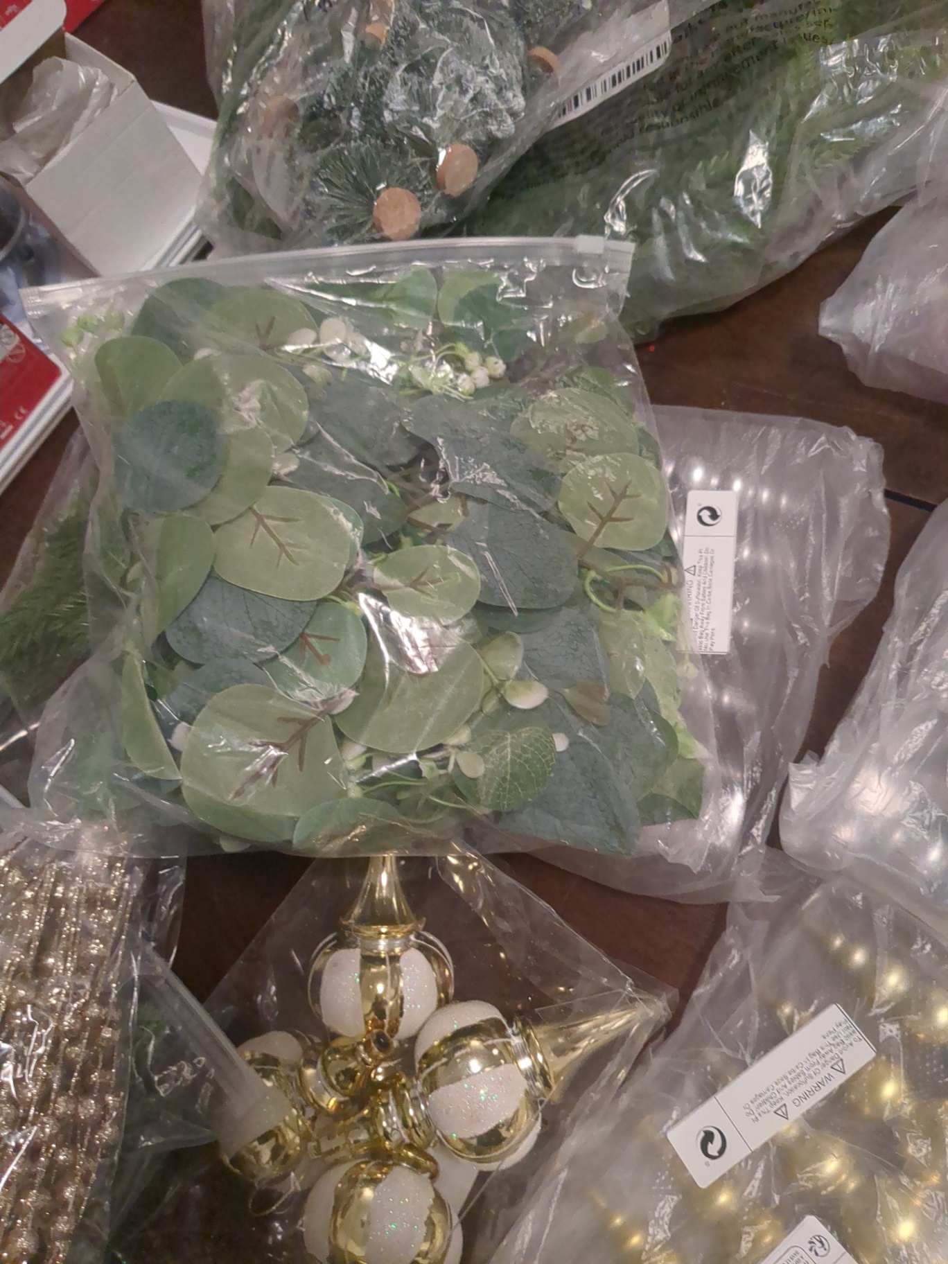 Christmas decorations and plastic green tree decorations  - image 7 of 10