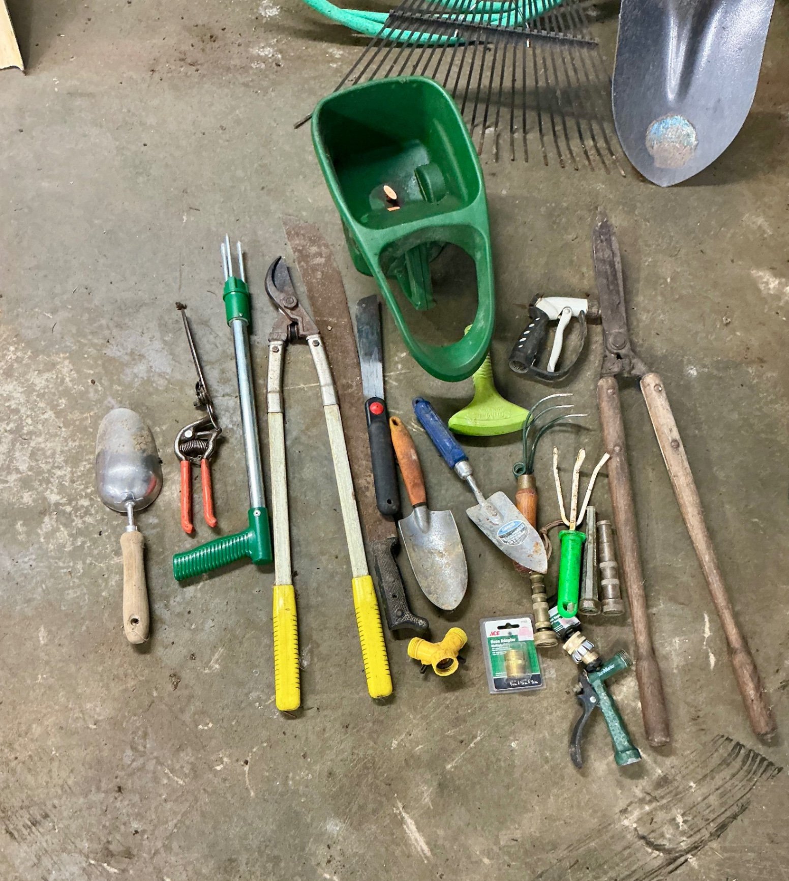 Blue wheelbarrow with garden tools and hose - image 2 of 6