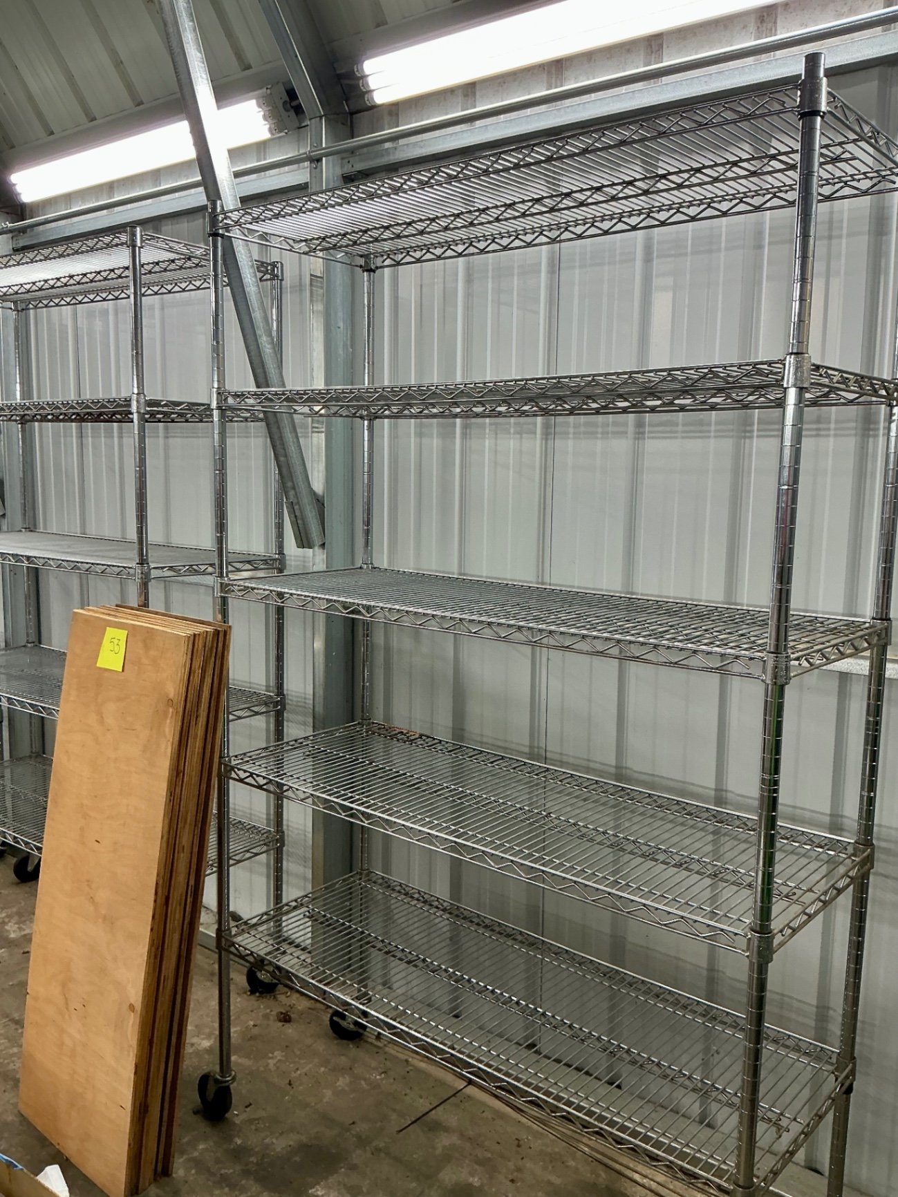 Mobile wire shelving units with plywood boards - image 3 of 3