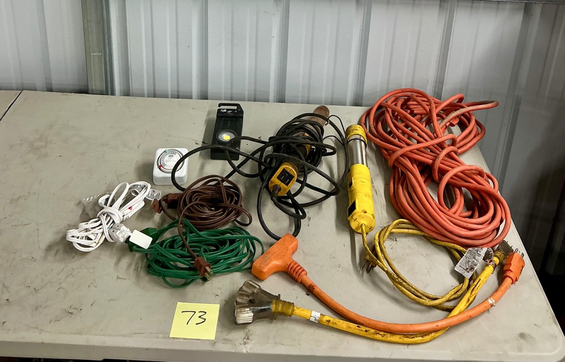 Assorted extension cords and lighting - image 1 of 5
