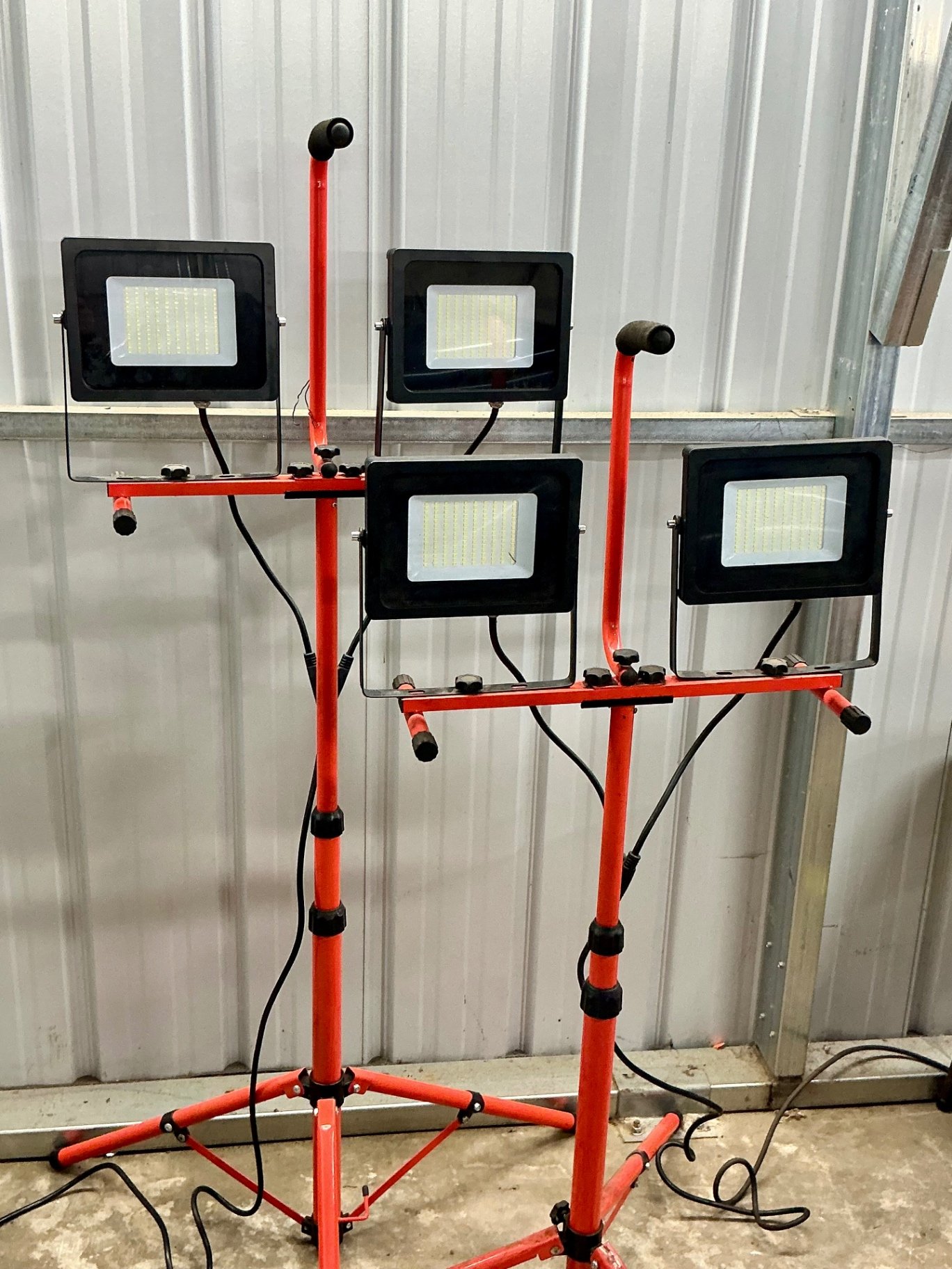 LED floodlights on red tripod stands - image 2 of 3