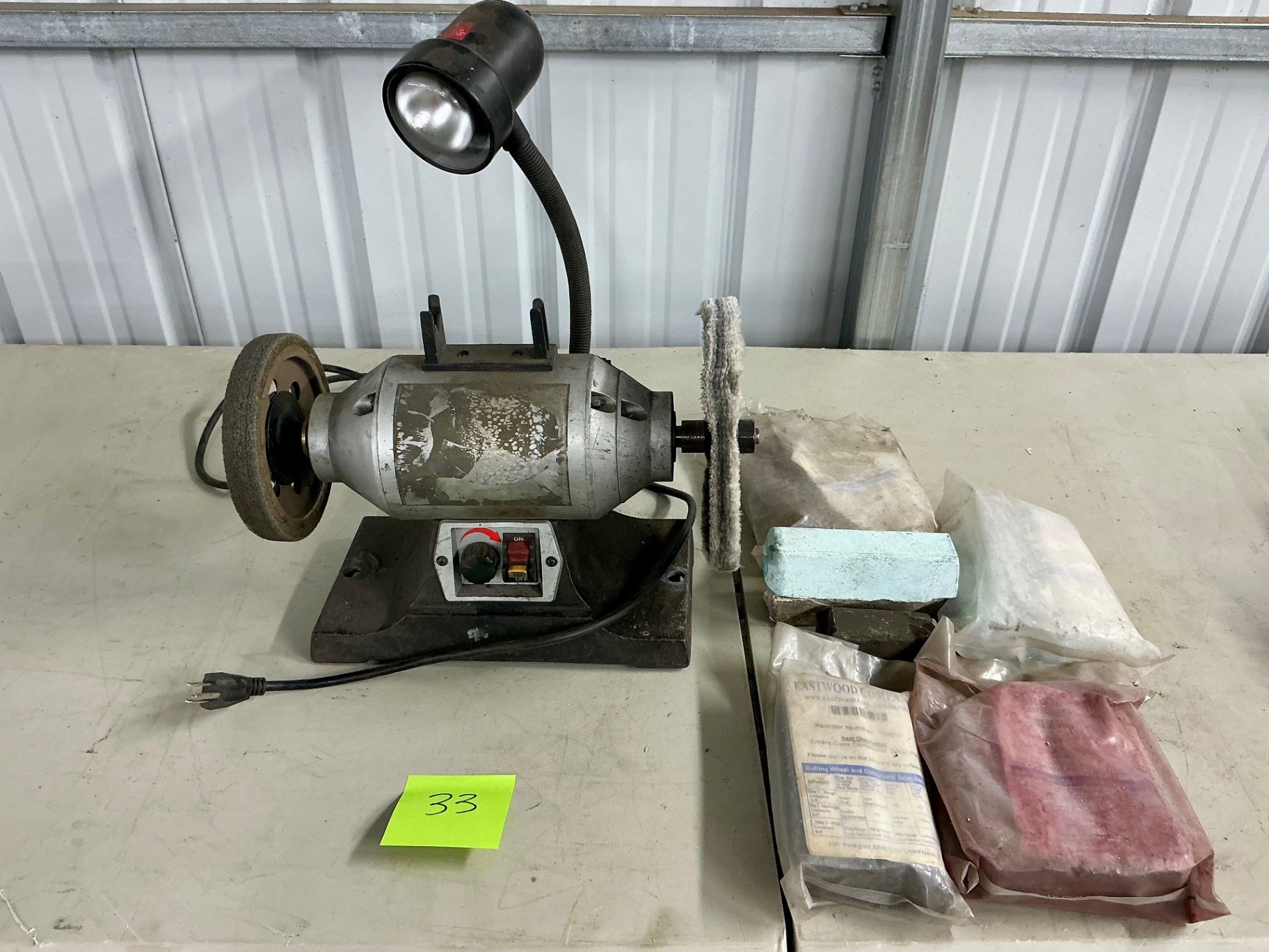Bench grinder with buffing wheels and polishing compound - image 1 of 3