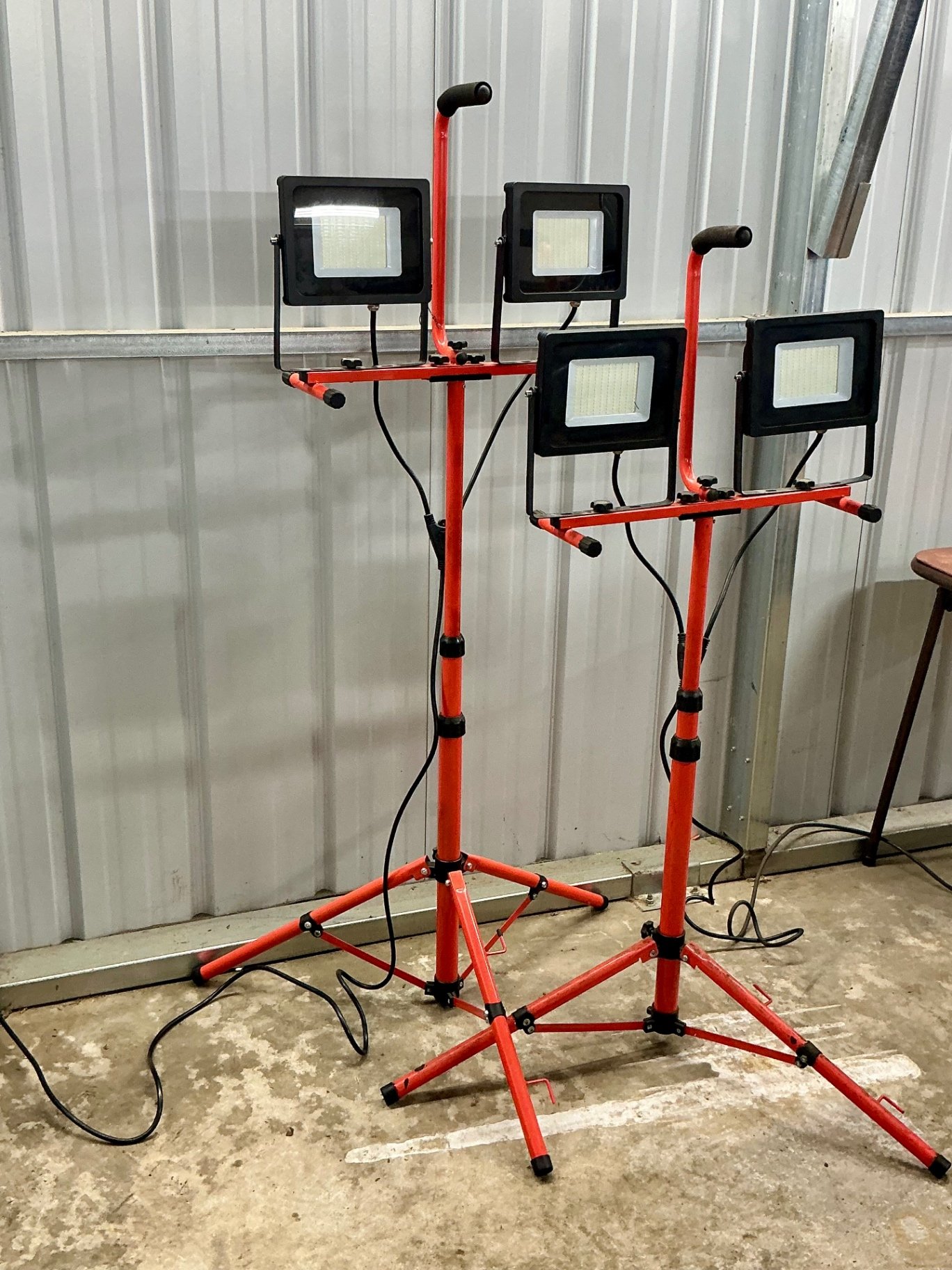 LED floodlights on red tripod stands - image 1 of 3