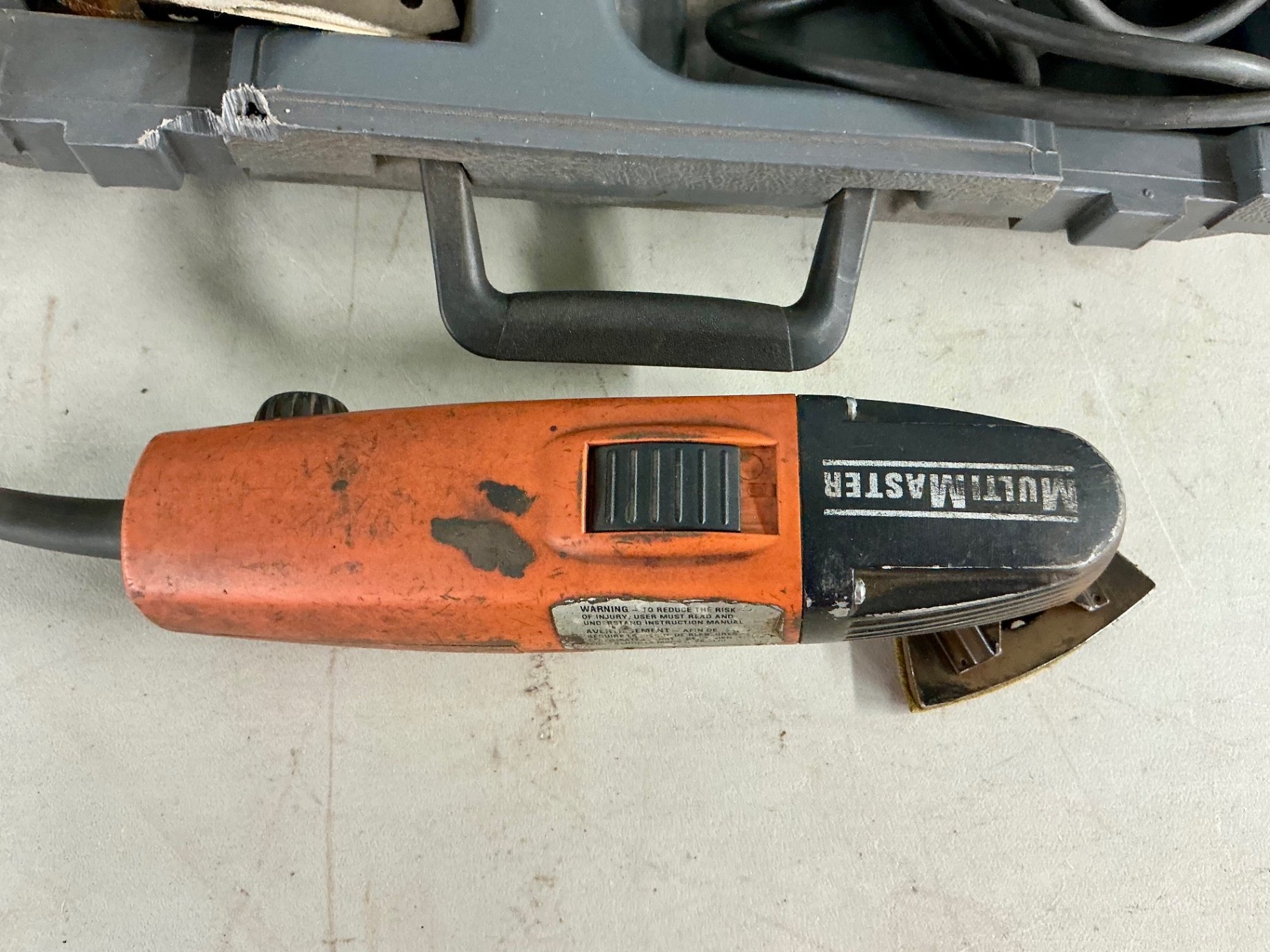 Multi-tool and blue Bosch palm router with accessories - image 4 of 5