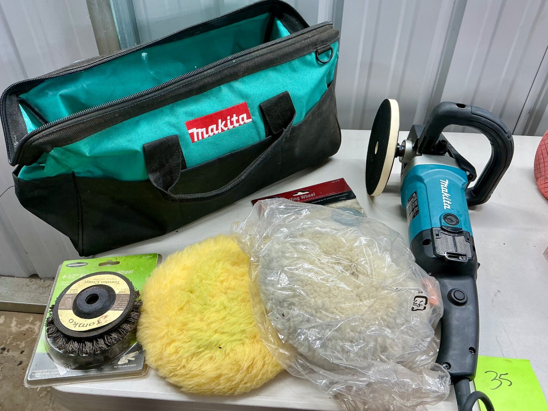 Makita angle grinder with polishing pads and accessories - image 1 of 4