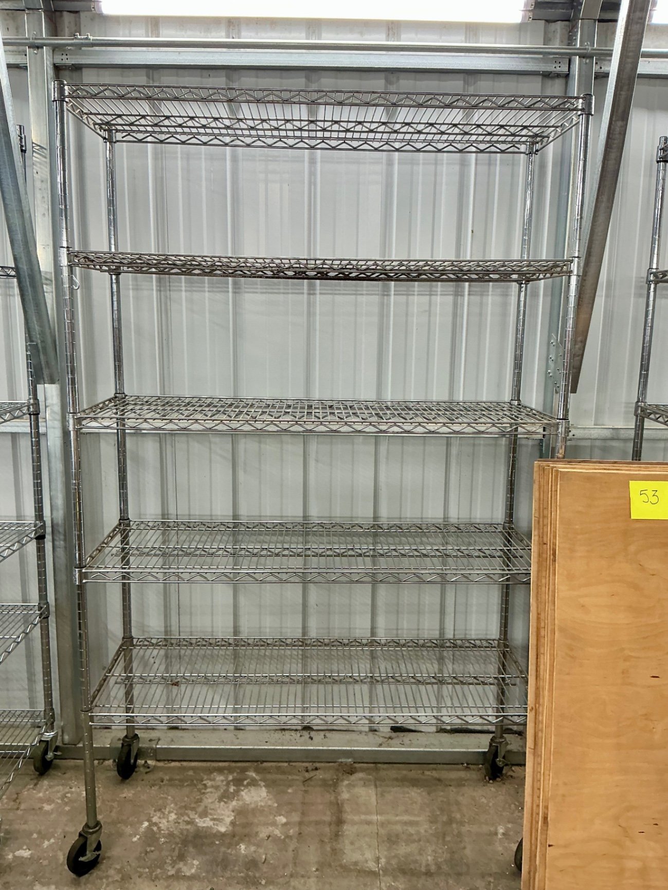 Mobile wire shelving units with plywood boards - image 2 of 3