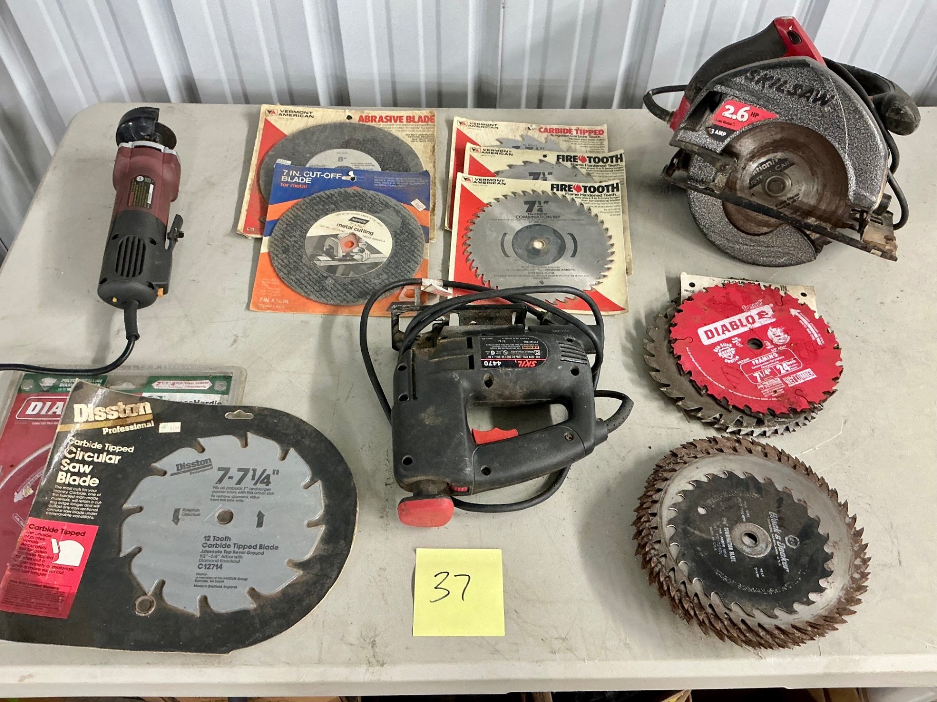 Assorted power tools and cutting blades - image 1 of 6