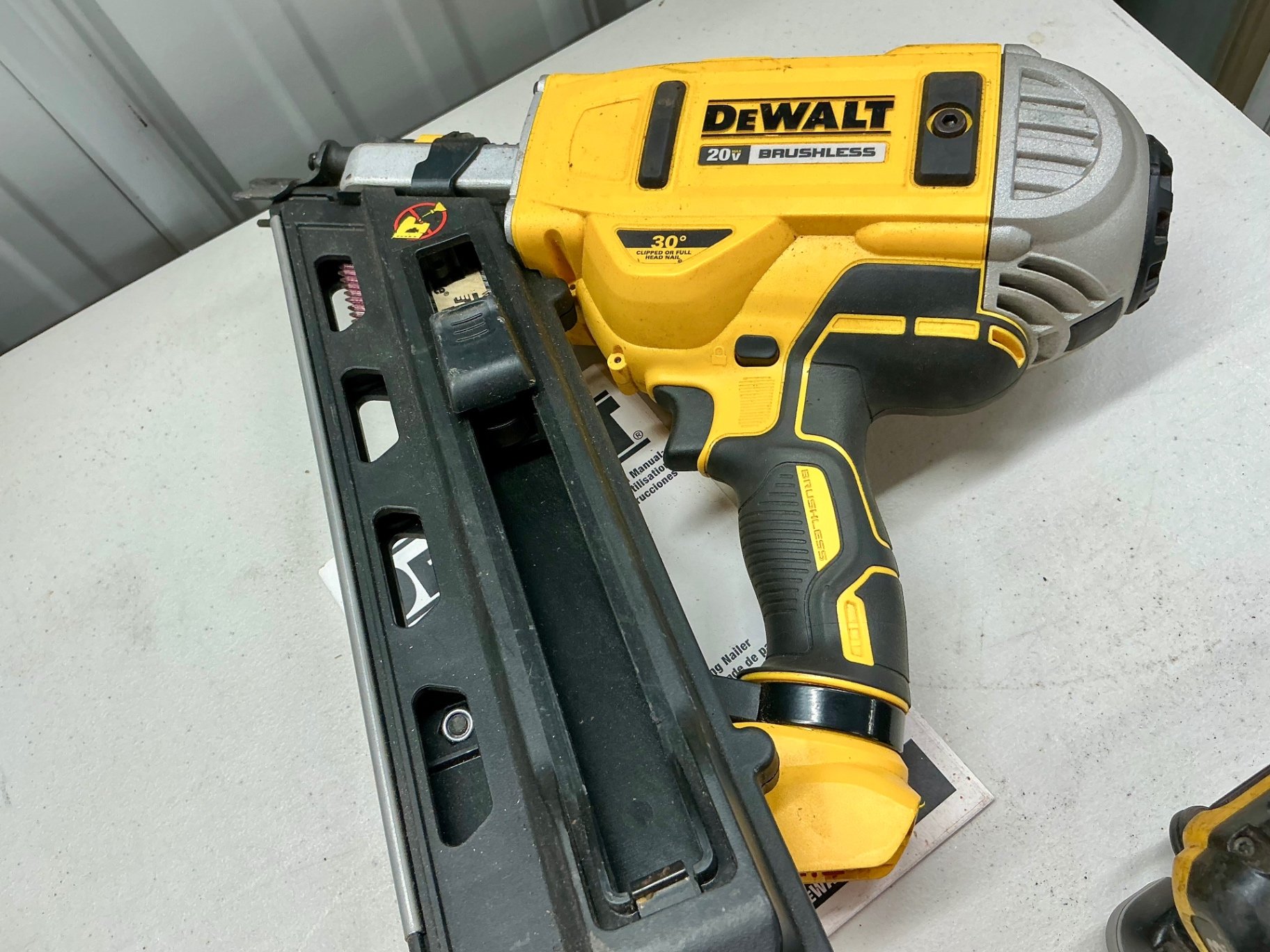 DeWalt 20V Max cordless framing nailer with charger, manual, and Paslode RoundDrive nails - image 3 of 5