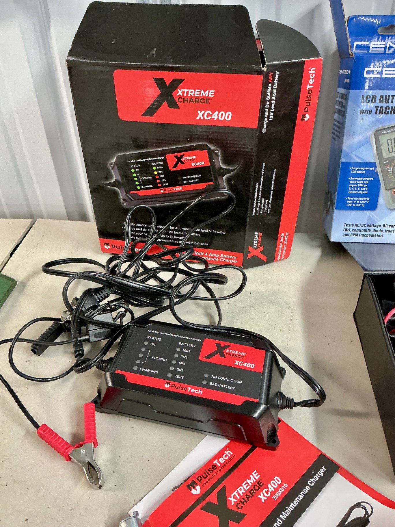 Automotive electrical tool kit with multimeter, battery charger, crimping tool, and socket set - image 5 of 6