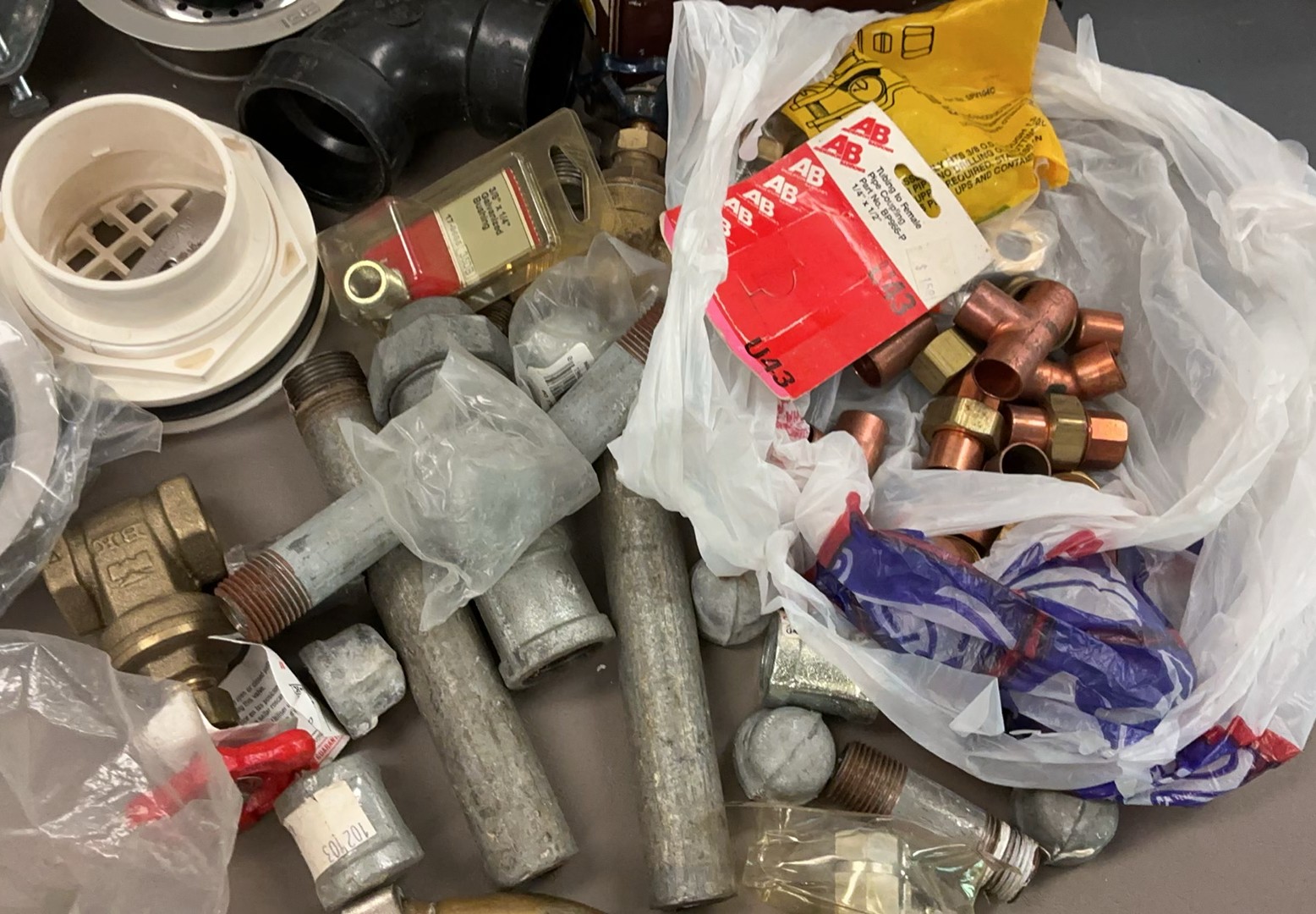 Assorted plumbing fittings, pipes, and fixtures - image 9 of 13