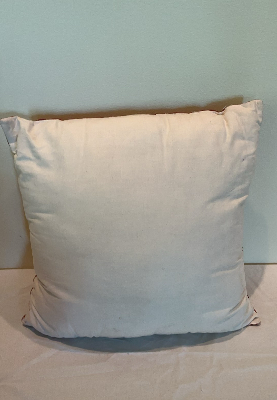 Decorative pillows with crocheted lace covers and red throw blanket - image 5 of 5
