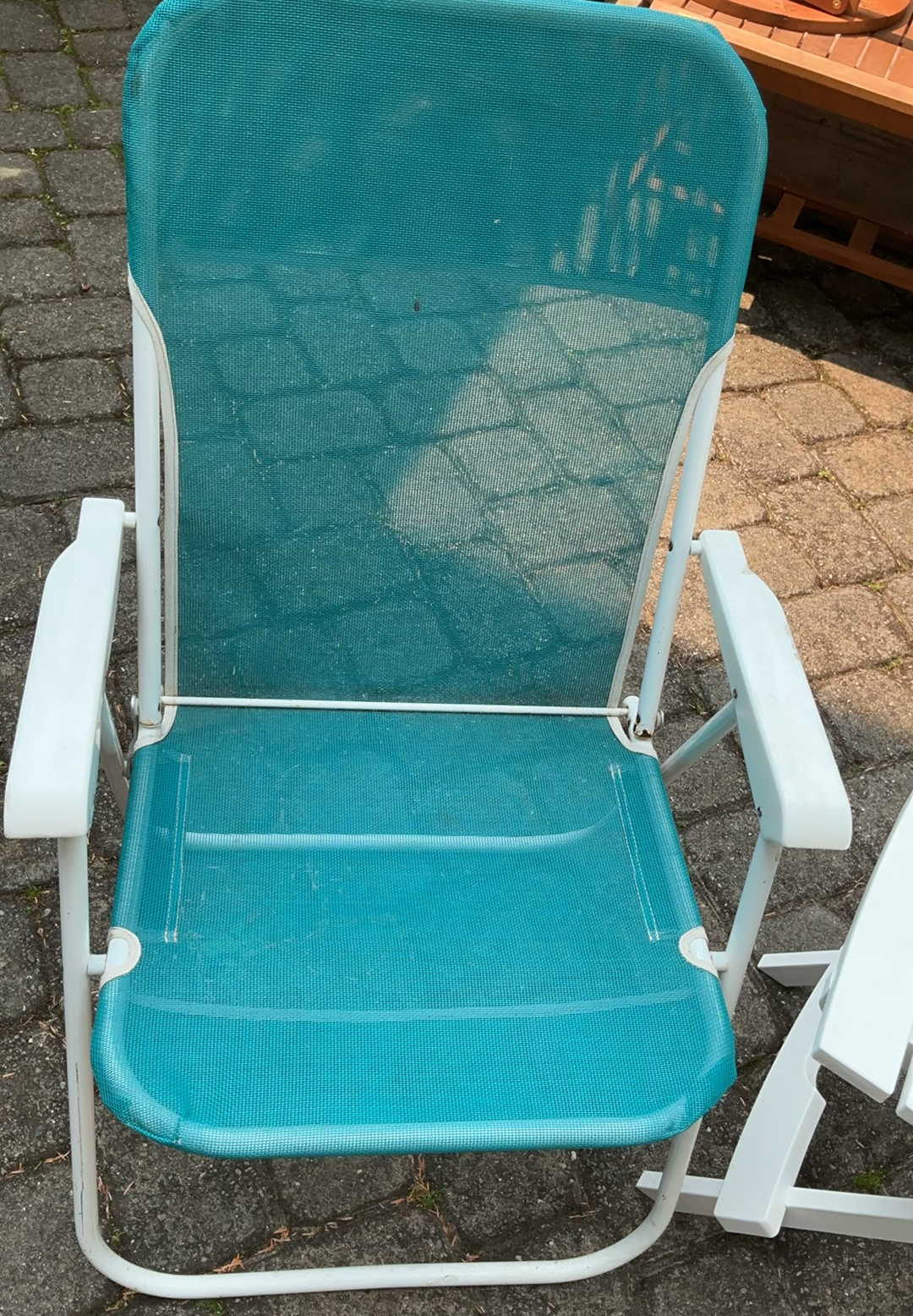 Outdoor patio furniture set: turquoise mesh chairs with white frames, a white folding table, and stacked white folding chairs - image 2 of 6