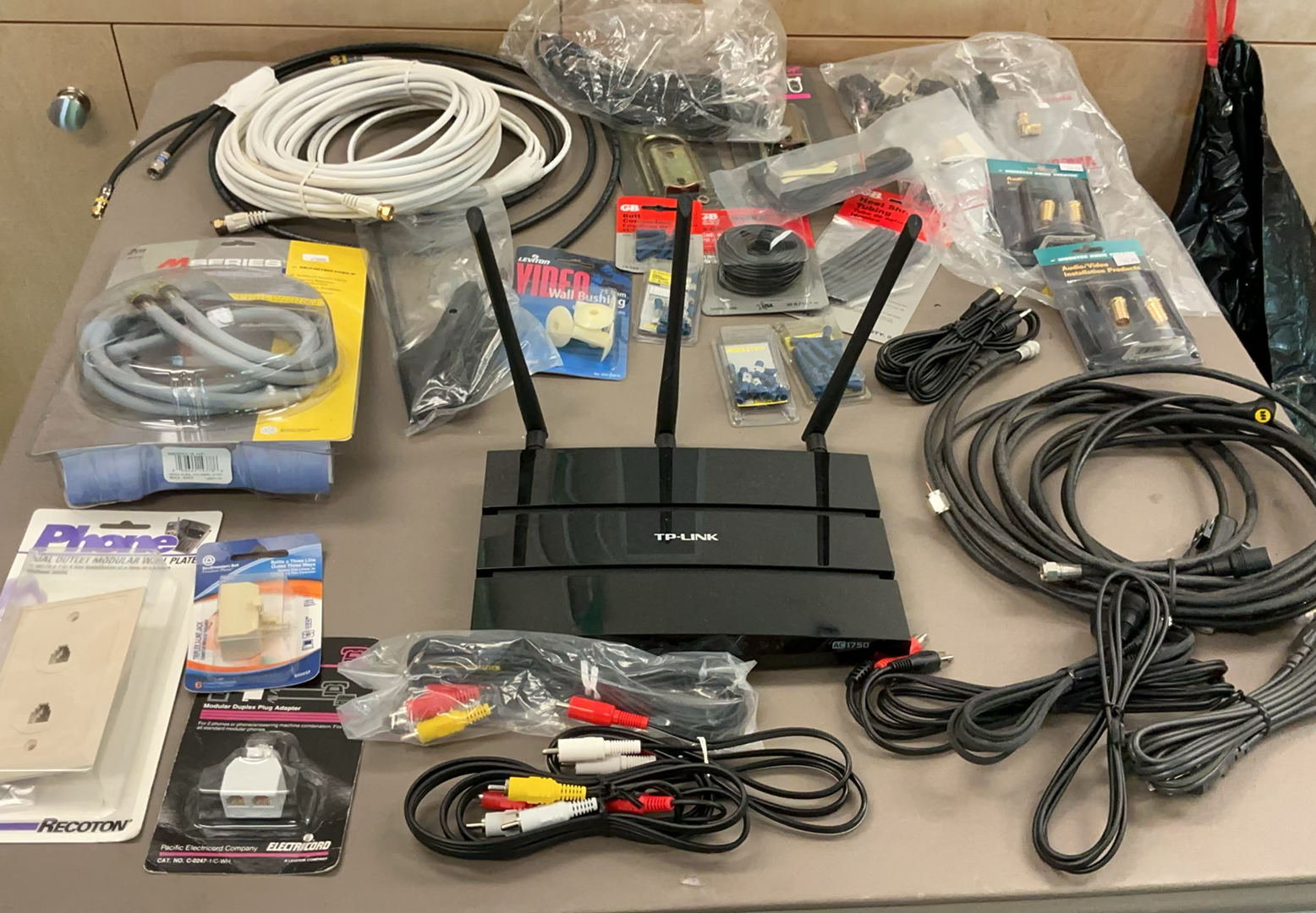 TP-Link Router with assorted AV cables and accessories - image 1 of 8