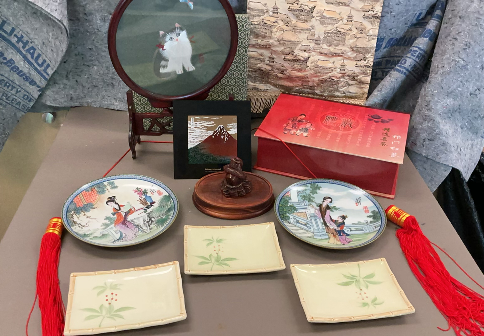 Assorted Chinese porcelain plates, teacups, and decorative display items - image 1 of 11