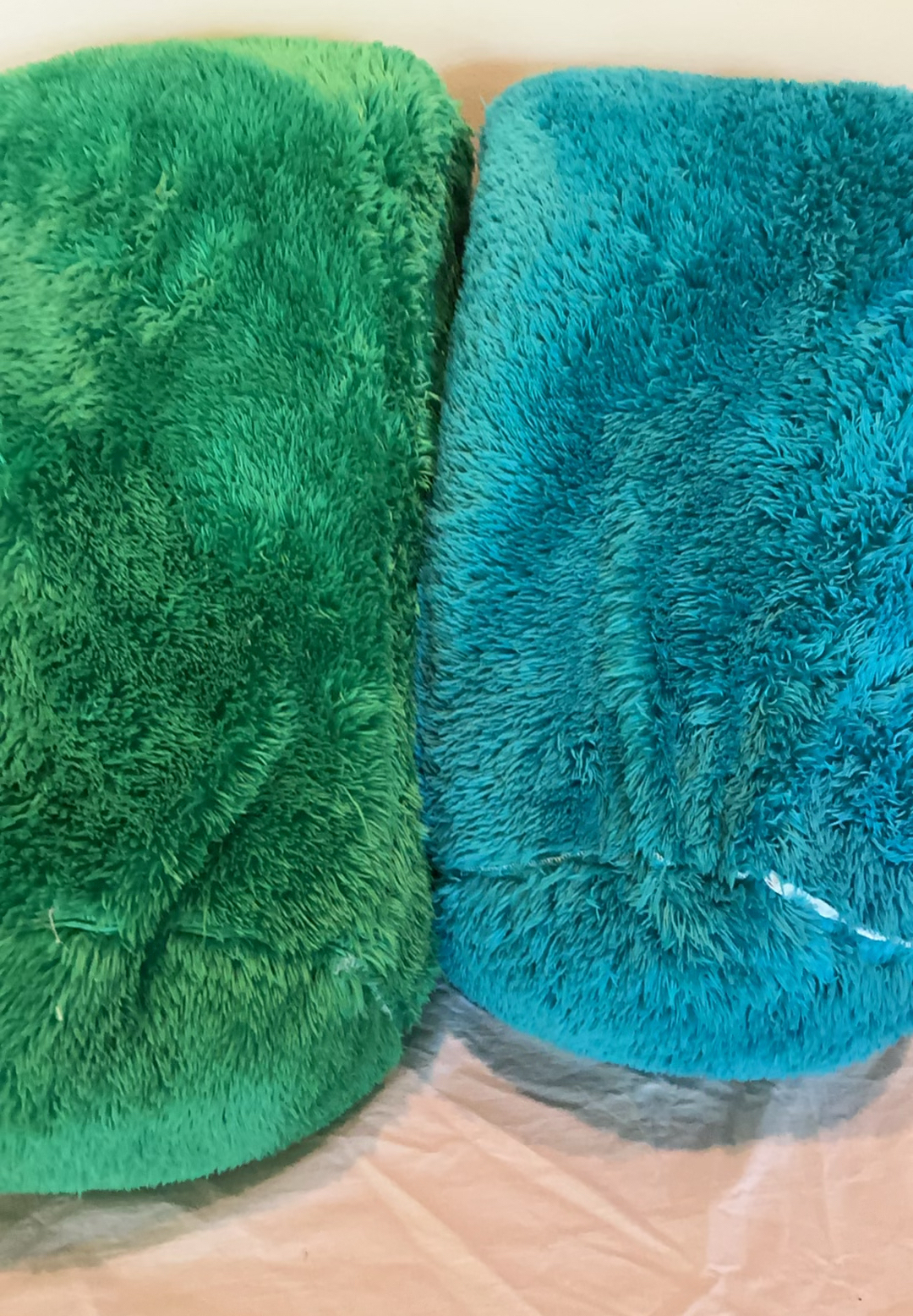 Two fluffy green and teal plush body pillows - image 1 of 3